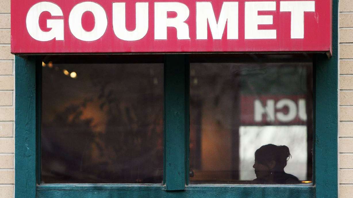 A lunch customer eats inside the Training Table Restaurant in Layton on Nov. 16, 2006. Utah's iconic phone call burger joint might be coming back following a six-year closure.