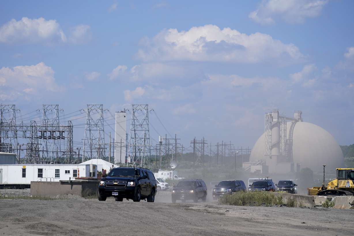 The motorcade for President Joe Biden arrives for an event at Brayton Power Station, Wednesday, in Somerset, Mass.