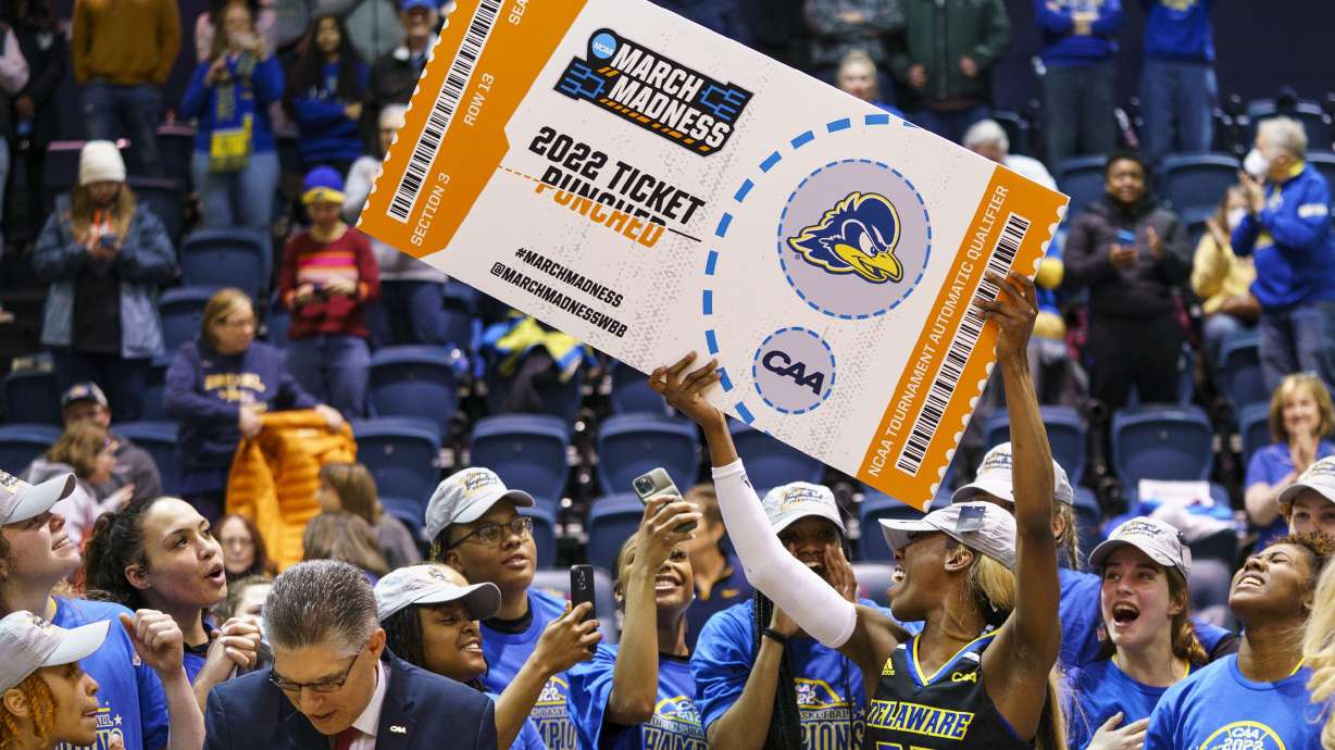 FILE - Delaware's Jasmine Dickey holds up the March Madness ticket following the second half of an NCAA college basketball championship game against Drexel in the Colonial Athletic Association Conference Tournament, Sunday, March 13, 2022, in Philadelphia. Delaware won 63-59. The NCAA has adequately addressed nine of 23 recommendations for creating comparable NCAA Tournament experiences for men's and women's basketball players, according to a progress report released Wednesday. July 20, 2022.