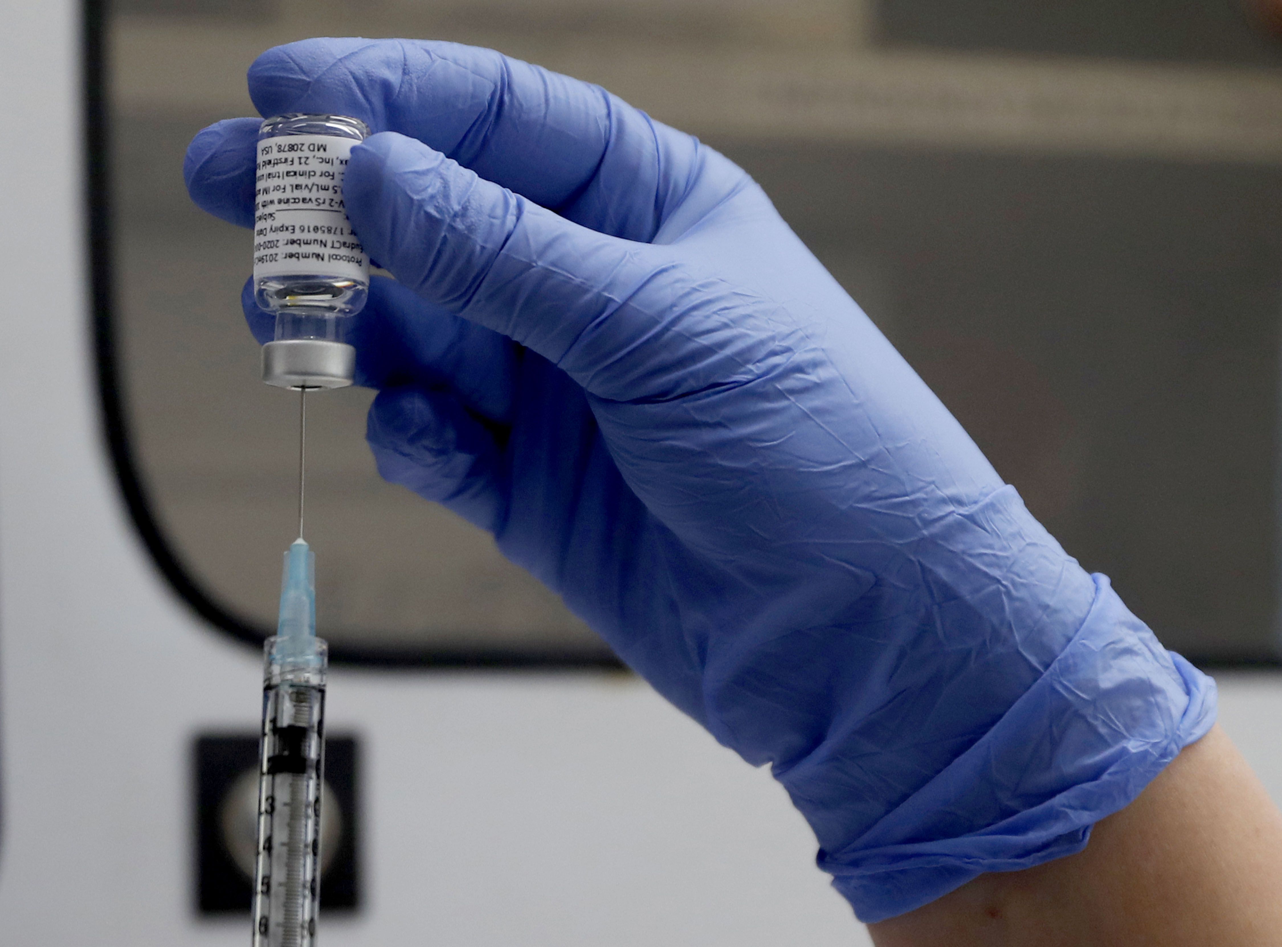 A vial of the Phase 3 Novavax coronavirus vaccine is seen ready for use in the trial at St. George’s University hospital in London, on Oct. 7, 2020.