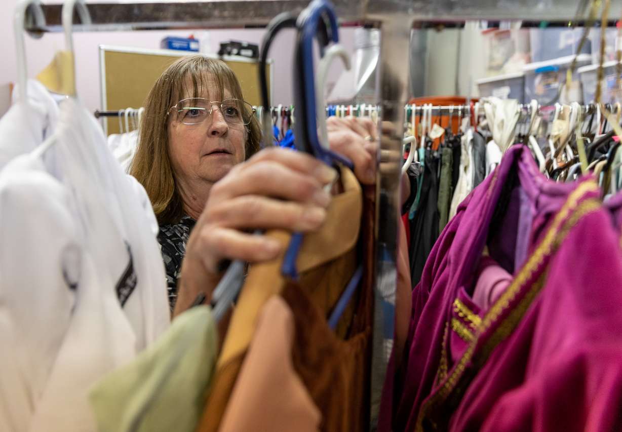 Cheryl Yeager sorts through the inventory of costumes that will be sold off as she prepares to close Odyssey Dance Theater in Draper on Tuesday. Yeager and her husband, Derryl Yeager, started Odyssey Dance Theater 28 years ago.
