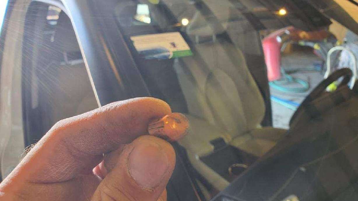The Blattner family thought it was a rock that had launched through their vehicle's windshield, grazing two adults in the vehicle. They later learned it was a bullet. This .45 caliber bullet was found in Dallas Blattner’s vehicle.