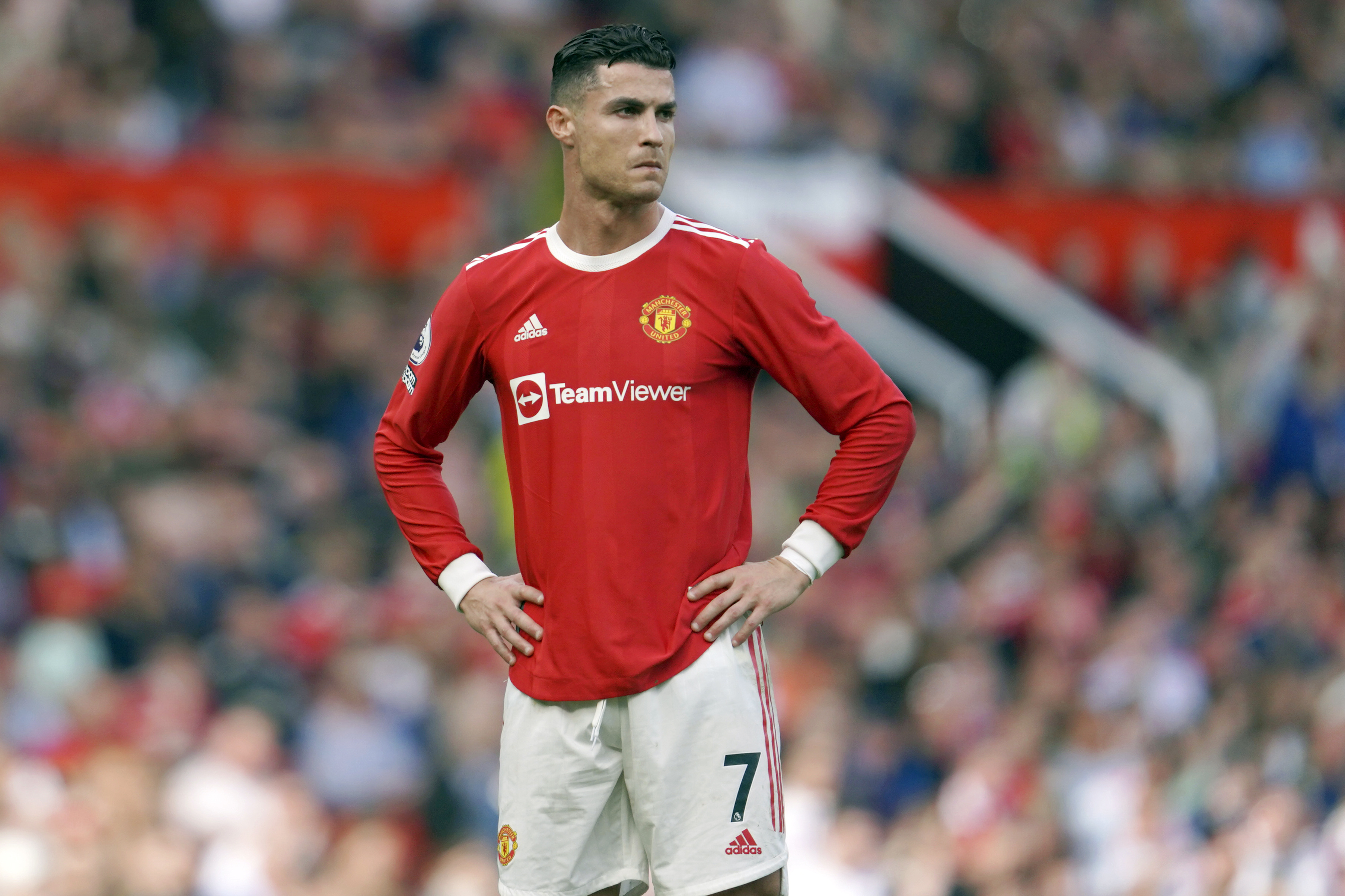 FILE- Manchester United's Cristiano Ronaldo stands on the pitch during the English Premier League soccer match between Manchester United and Norwich City at Old Trafford stadium in Manchester, England, on April 16, 2022. By Thursday, July 21, 2022, Cristiano Ronaldo has not yet returned to preseason training with Manchester United because of what has been publicly described as “personal reasons.” Ronaldo reportedly wants out after only one season back at Old Trafford because United is no longer in the Champions League or in shape to compete with the best teams in England. 