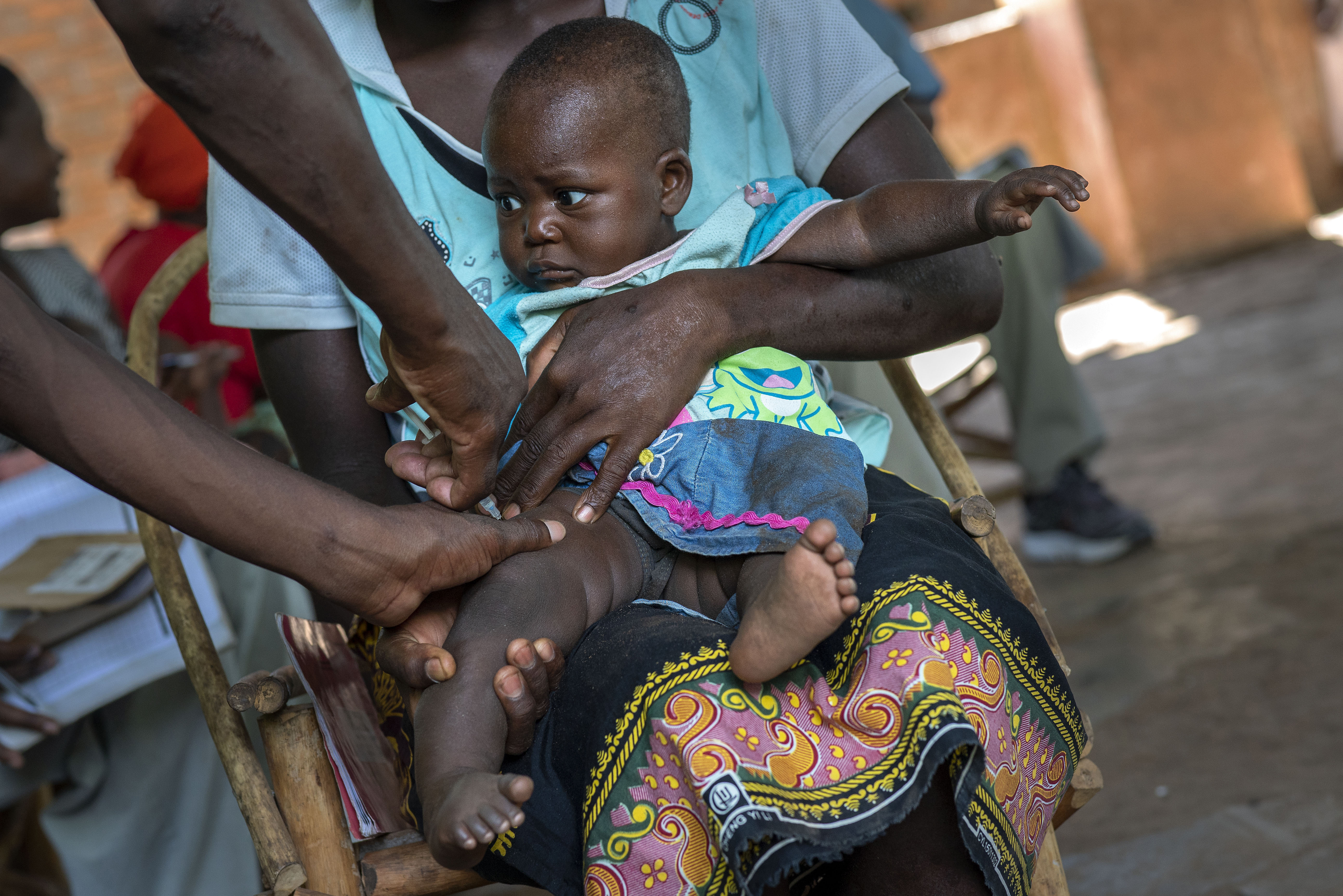 A baby from the Malawi village of Tomali is injected with the world's first vaccine against malaria in a pilot program, in Tomali, Dec. 11, 2019. As the World Health Organization announces Thursday, July 21, 2022 the next step in its rollout of the world's first authorized malaria vaccine in several African countries, the Bill and Melinda Gates Foundation says it will no longer financially support the shot. 