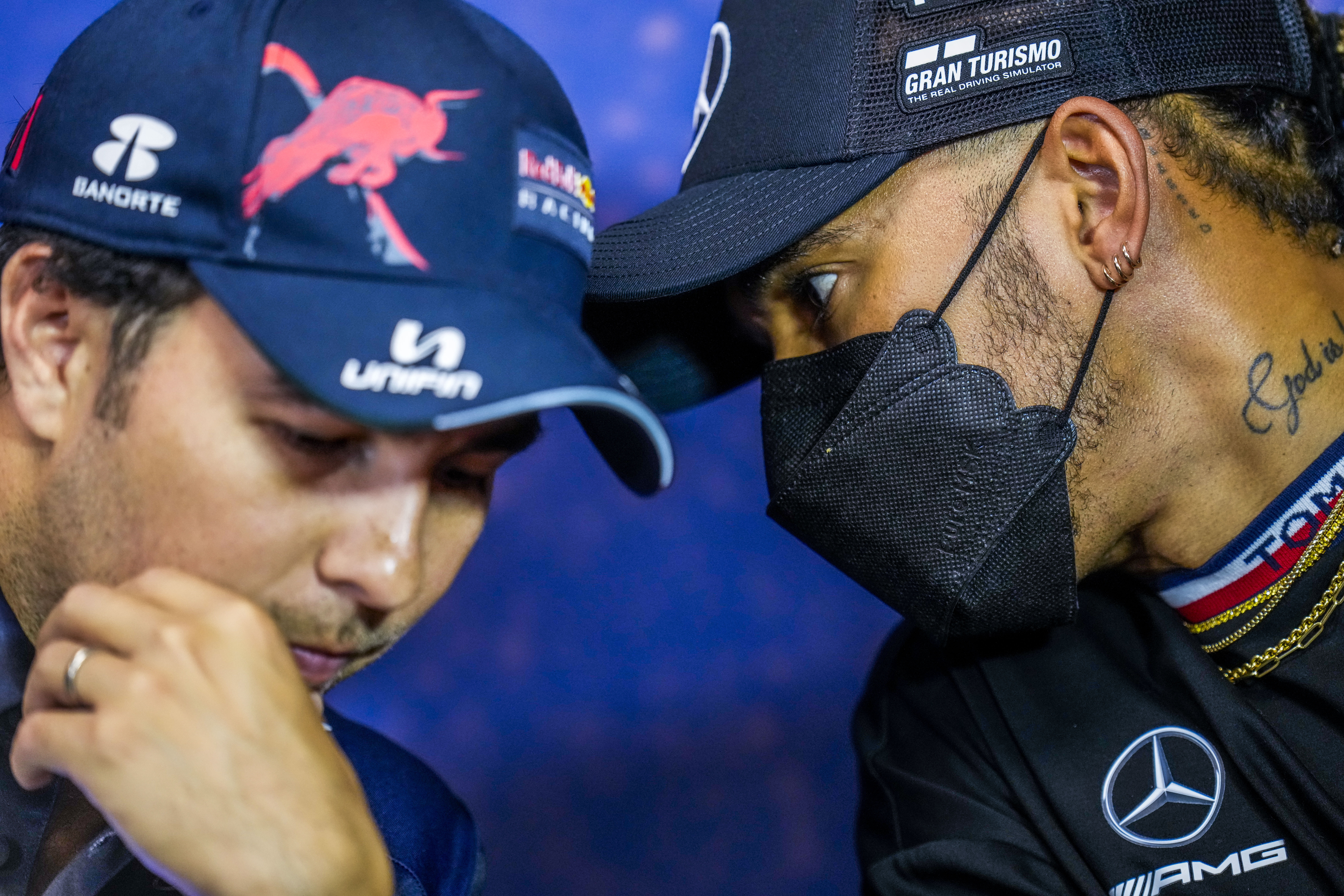 Mercedes driver Lewis Hamilton of Britain, right, talks with Red Bull driver Sergio Perez of Mexico during a press conference ahead of the French Formula One Grand Prix at the Paul Ricard racetrack in Le Castellet, southern France, Thursday, July 21, 2022. The French Grand Prix will be held on Sunday. 