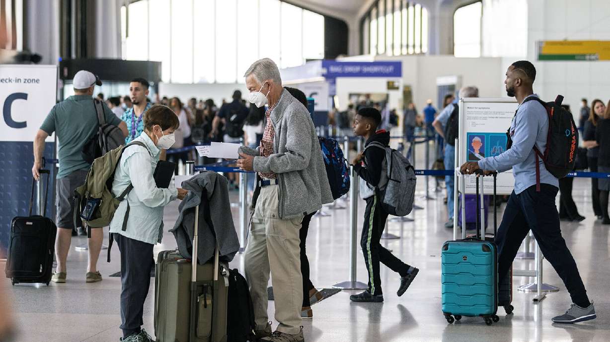 Travelers line up to check in at Newark Liberty International Airport on July 1. Newark is the world's No. 2 airport for cancellations this summer.