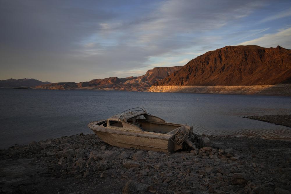 A formerly sunken boat sits high and dry along the shoreline of Lake Mead at the Lake Mead National Recreation Area, May 10, near Boulder City, Nev.