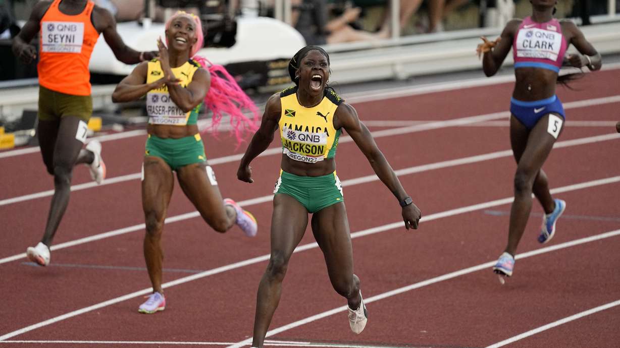 Shericka Jackson, of Jamaica, wins the final of the women's 200-meter run ahead of Shelly-Ann Fraser-Pryce, of Jamaica, at the World Athletics Championships on Thursday, July 21, 2022, in Eugene, Ore.