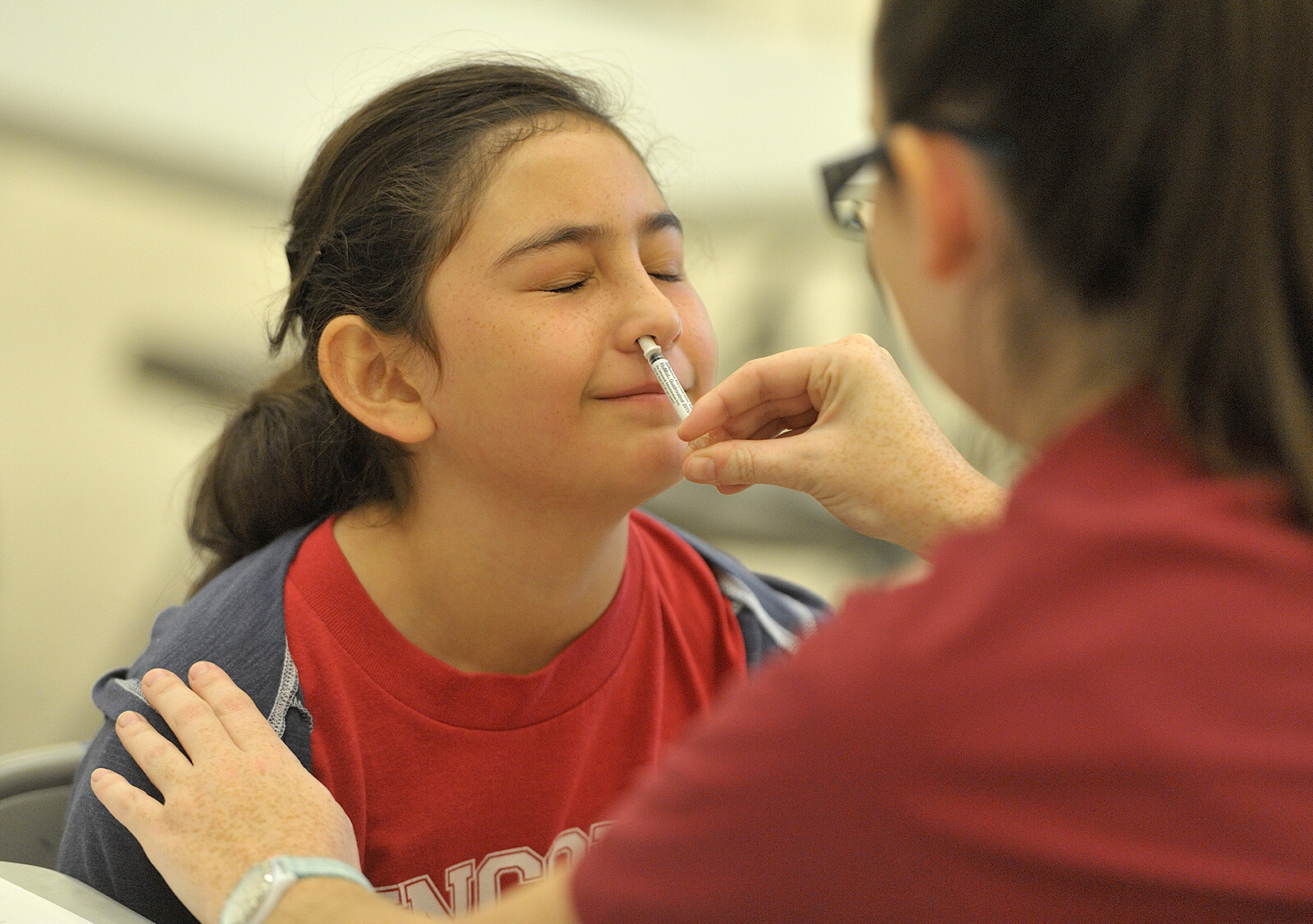 A student gets the FluMist vaccine, which stimulates mucosal immunity. Scientists are taking a different approach to COVID, making vaccines delivered via nasal sprays or tablets that would deploy more immune defenders to the body's front lines: the lining of the mouth, nose and throat.
