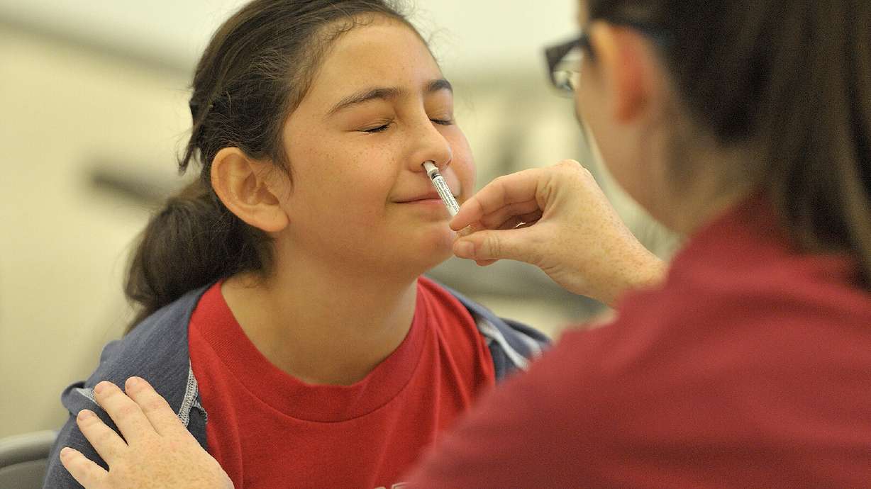 A student gets the FluMist vaccine, which stimulates mucosal immunity. Scientists are taking a different approach to COVID, making vaccines delivered via nasal sprays or tablets that would deploy more immune defenders to the body's front lines: the lining of the mouth, nose and throat.