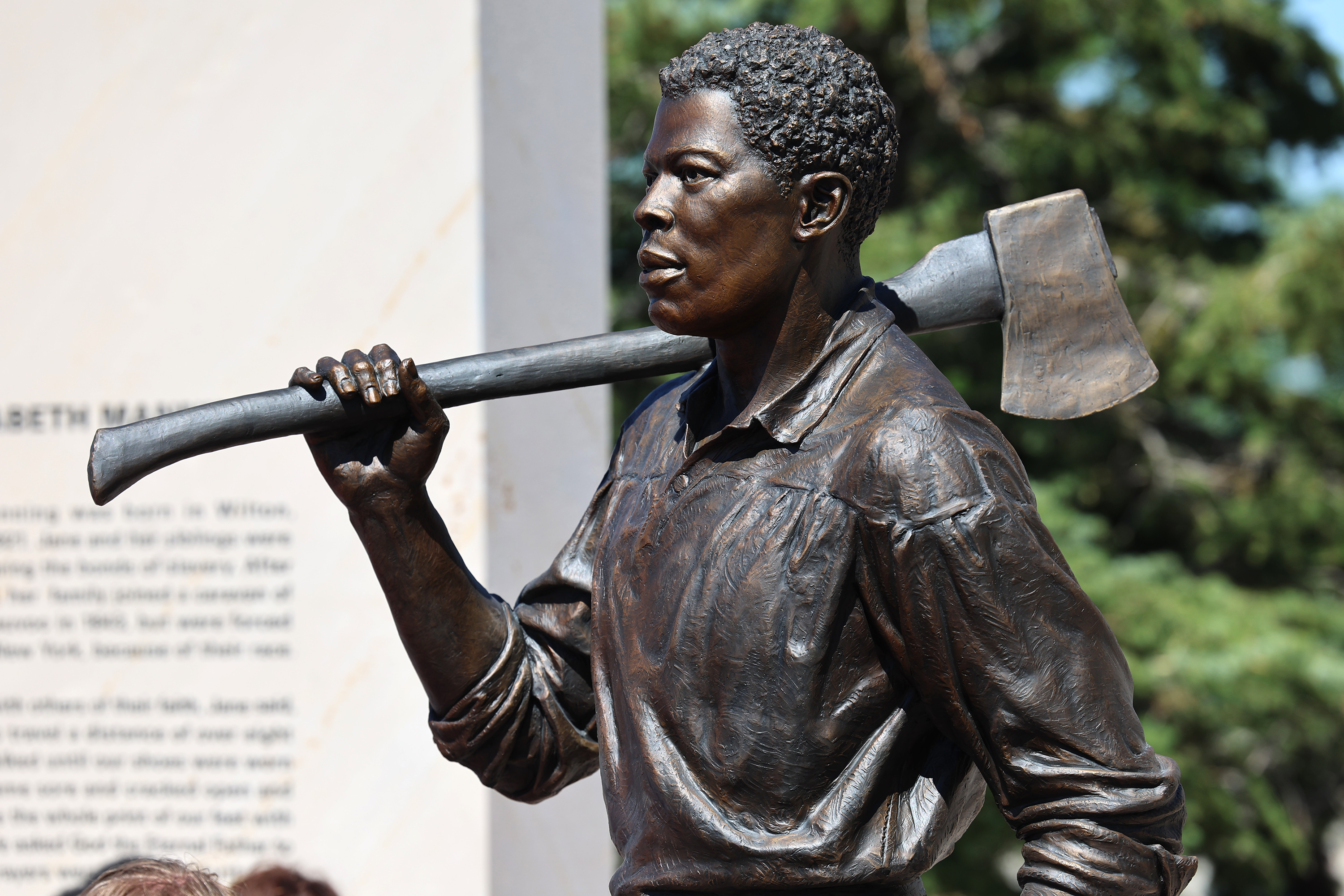 Green Flake, is depicted holding an ax at the new Black pioneers monument at This is the Place Heritage Park in Salt Lake City on Friday.