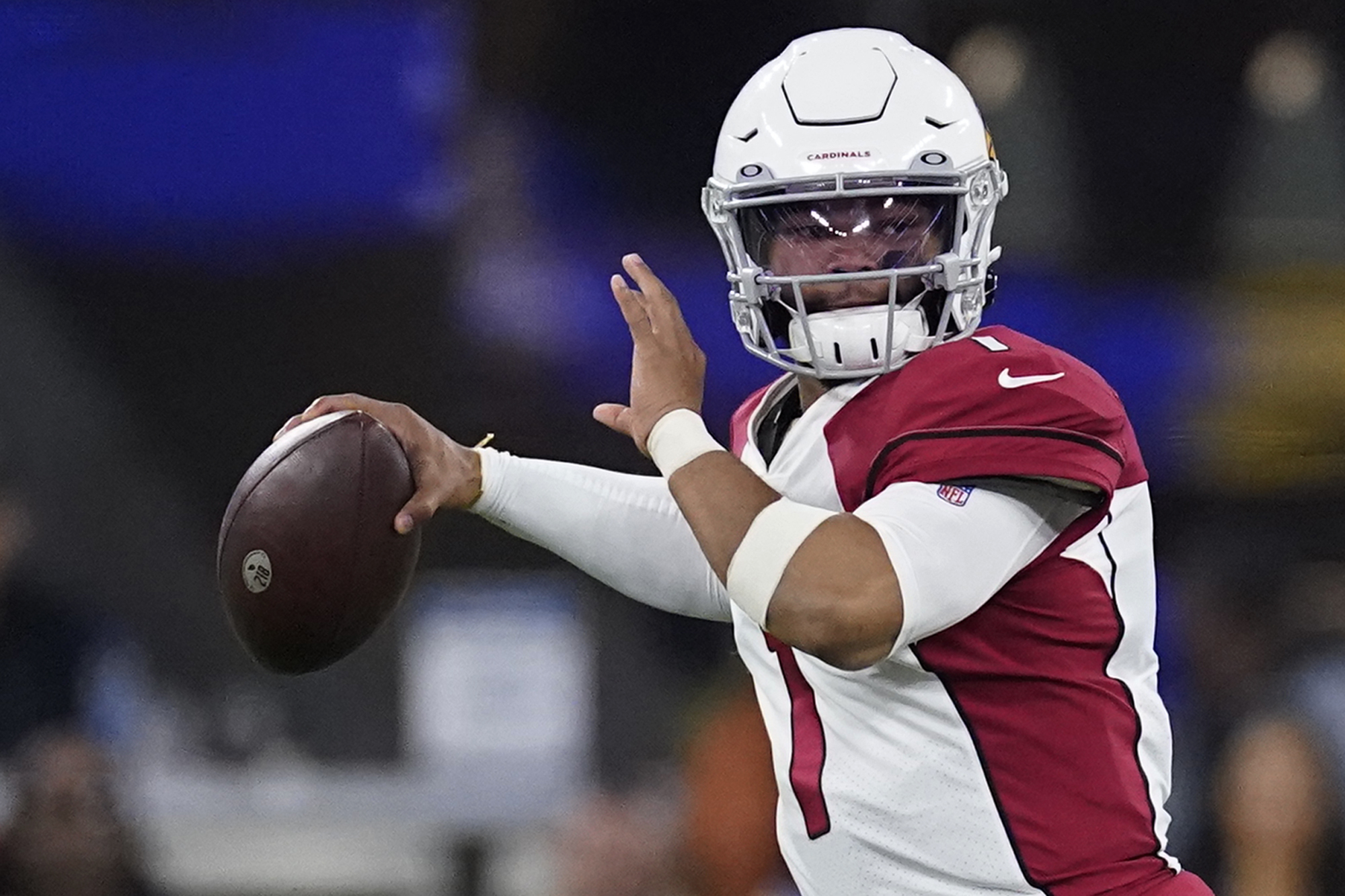 FILE - Arizona Cardinals quarterback Kyler Murray (1) passes against the Los Angeles Rams during the second half of an NFL wild-card playoff football game in Inglewood, Calif., Monday, Jan. 17, 2022. Kyler Murray has agreed to a long-term contract that will keep the quarterback with the Arizona Cardinals through the 2028 season. 