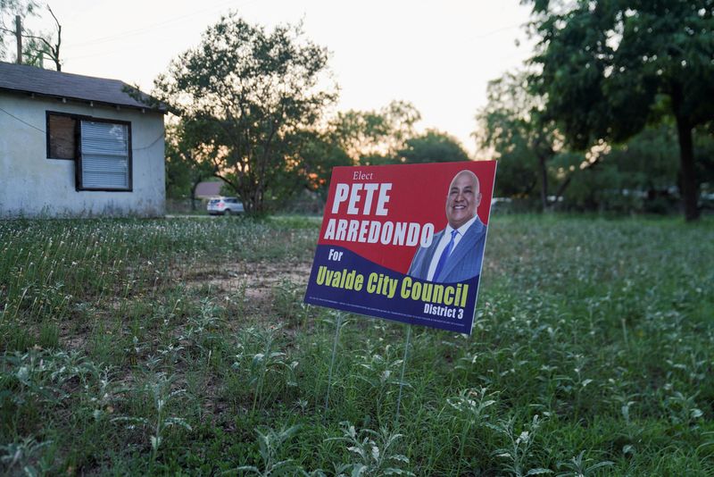 A political sign for Pete Arredondo, the Uvalde School District police chief, is seen in Uvalde, Texas, May 29. The school board in Uvalde, Texas, said on Friday it has postponed a vote on whether to fire the school district police chief criticized for his handling of the shooting rampage that killed 19 children and two teachers, but the chief has been suspended from duty in the meantime.