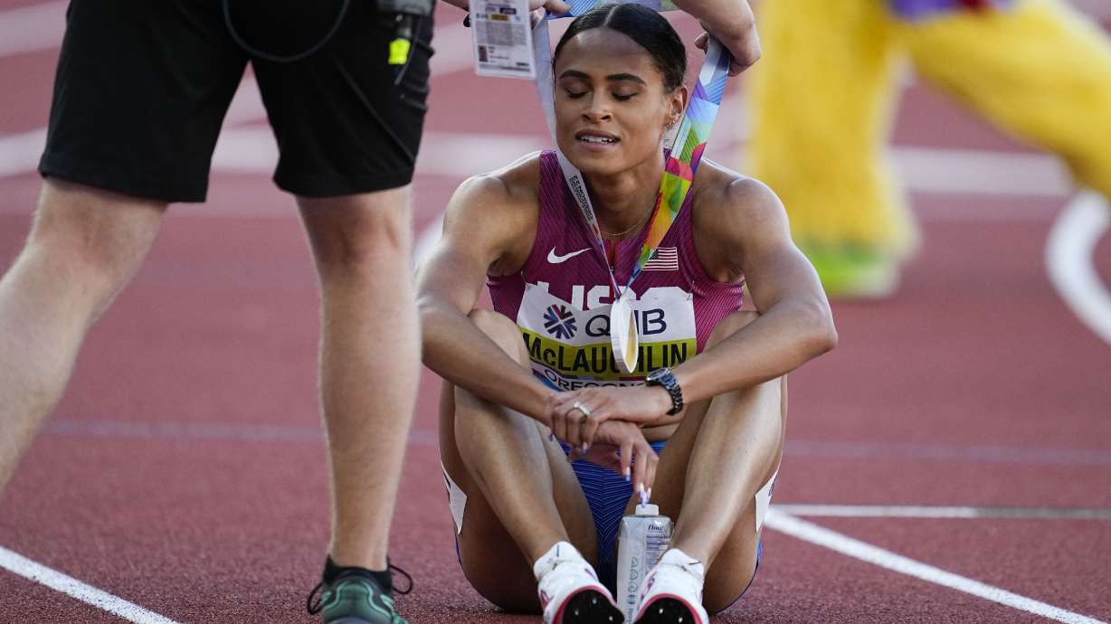 Sydney Mclaughlin, of the United States, receives her Gold medal after the final of the women's 400-meter hurdles at the World Athletics Championships on Friday, July 22, 2022, in Eugene, Ore.