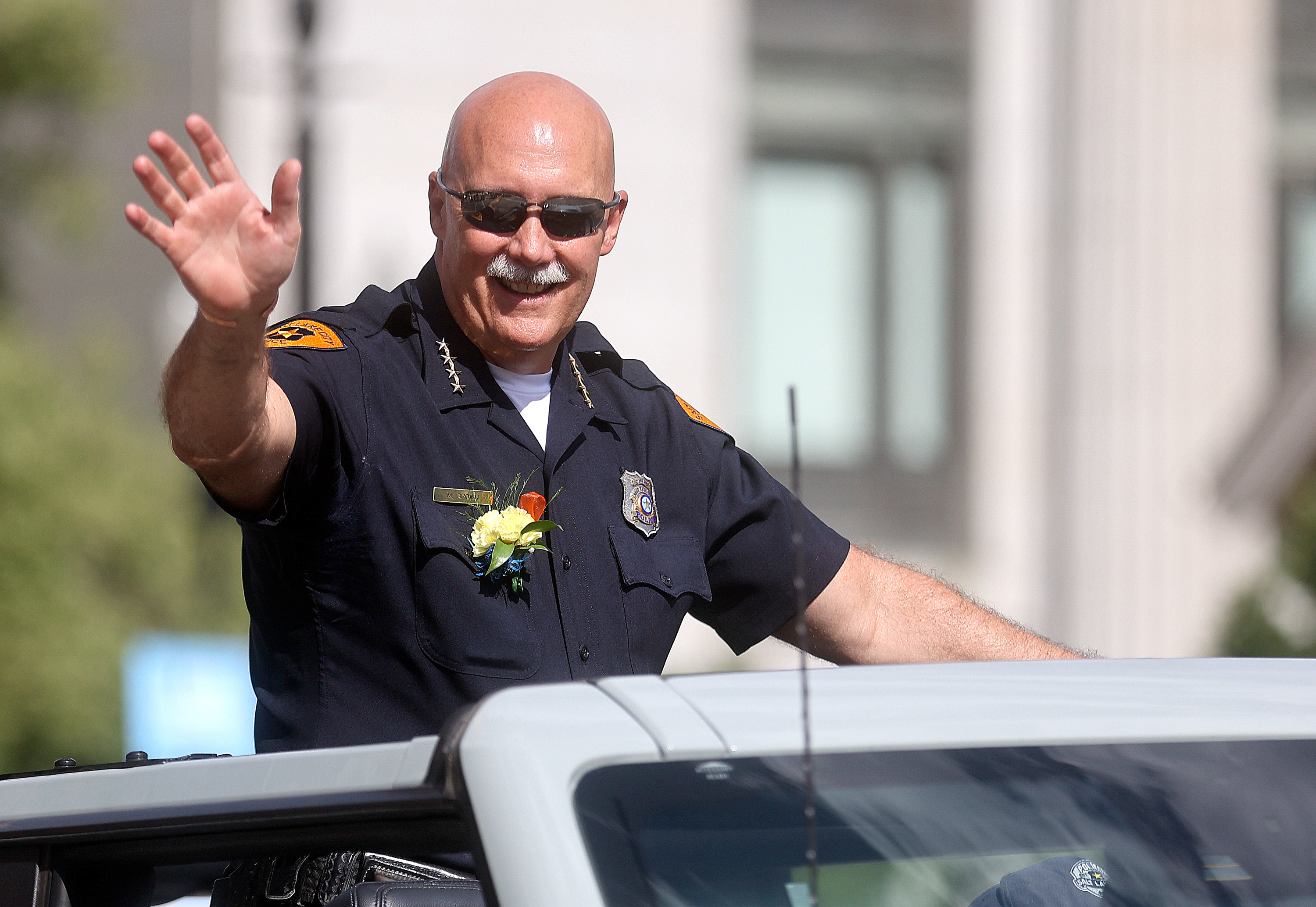 Salt Lake City Police Chief Mike Brown rides in the Days of ’47 Parade in Salt Lake City on July 23, 2022. Brown, the city's top law enforcer, says his last day on the job will be Feb. 28.