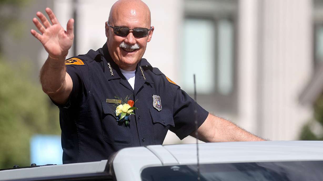 Salt Lake City Police Chief Mike Brown rides in the Days of ’47 Parade in Salt Lake City on July 23, 2022. Brown, the city's top law enforcer, says his last day on the job will be Feb. 28.