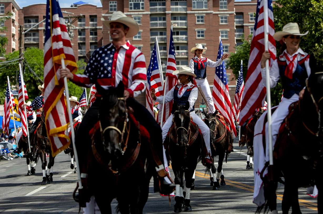 Members of Americanas greet parade goers along the Days of '47 parade route Saturday in Salt Lake City.