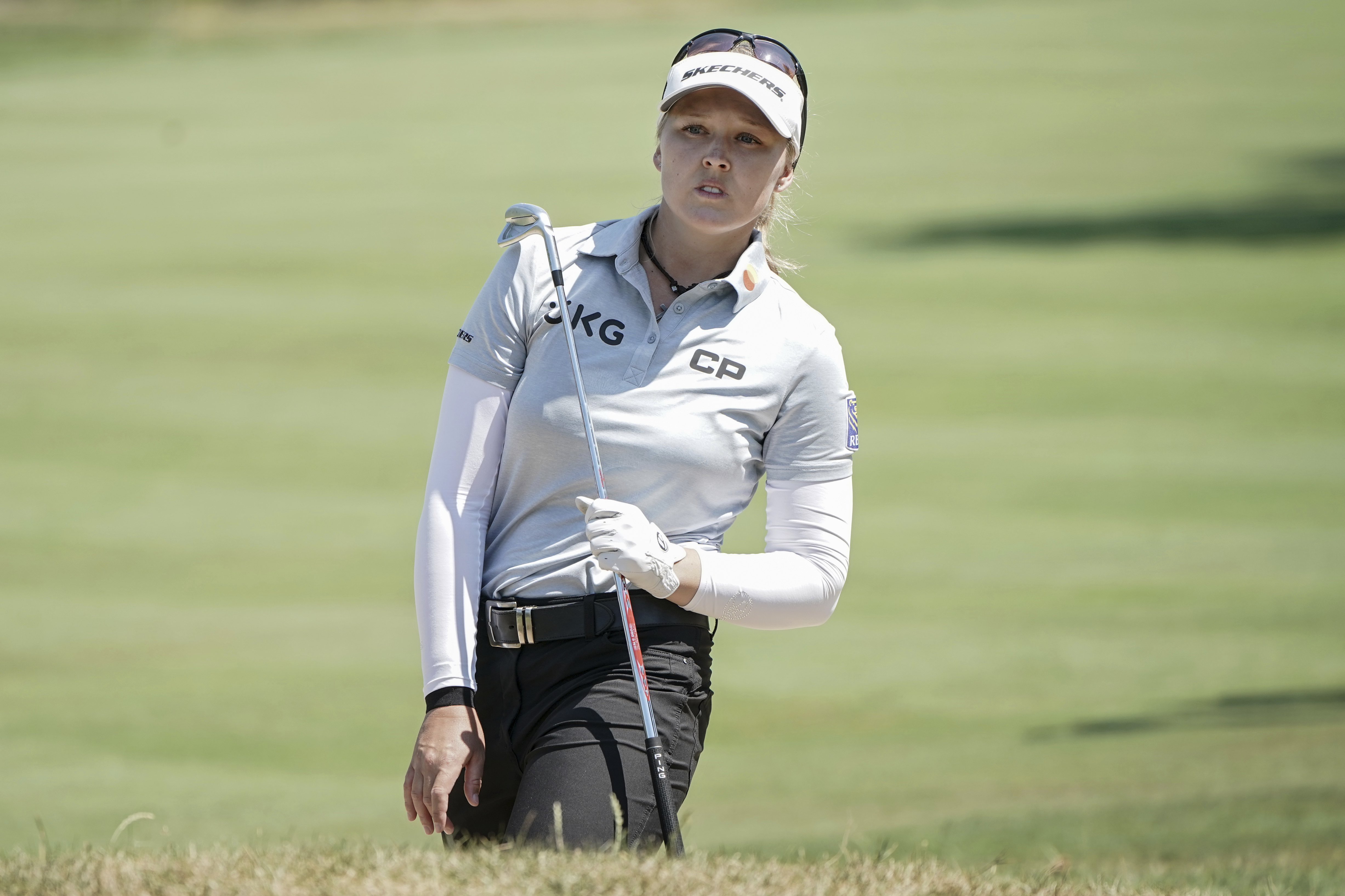 Brooke Henderson, of Canada, follows her ball after playing on the 5th hole during the last round of the Evian Championship women's golf tournament in Evian, eastern France, Sunday, July 24, 2022. 