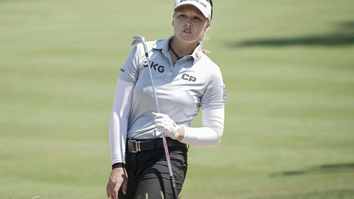 Brooke Henderson, of Canada, follows her ball after playing on the 5th hole during the last round of the Evian Championship women's golf tournament in Evian, eastern France, Sunday, July 24, 2022.