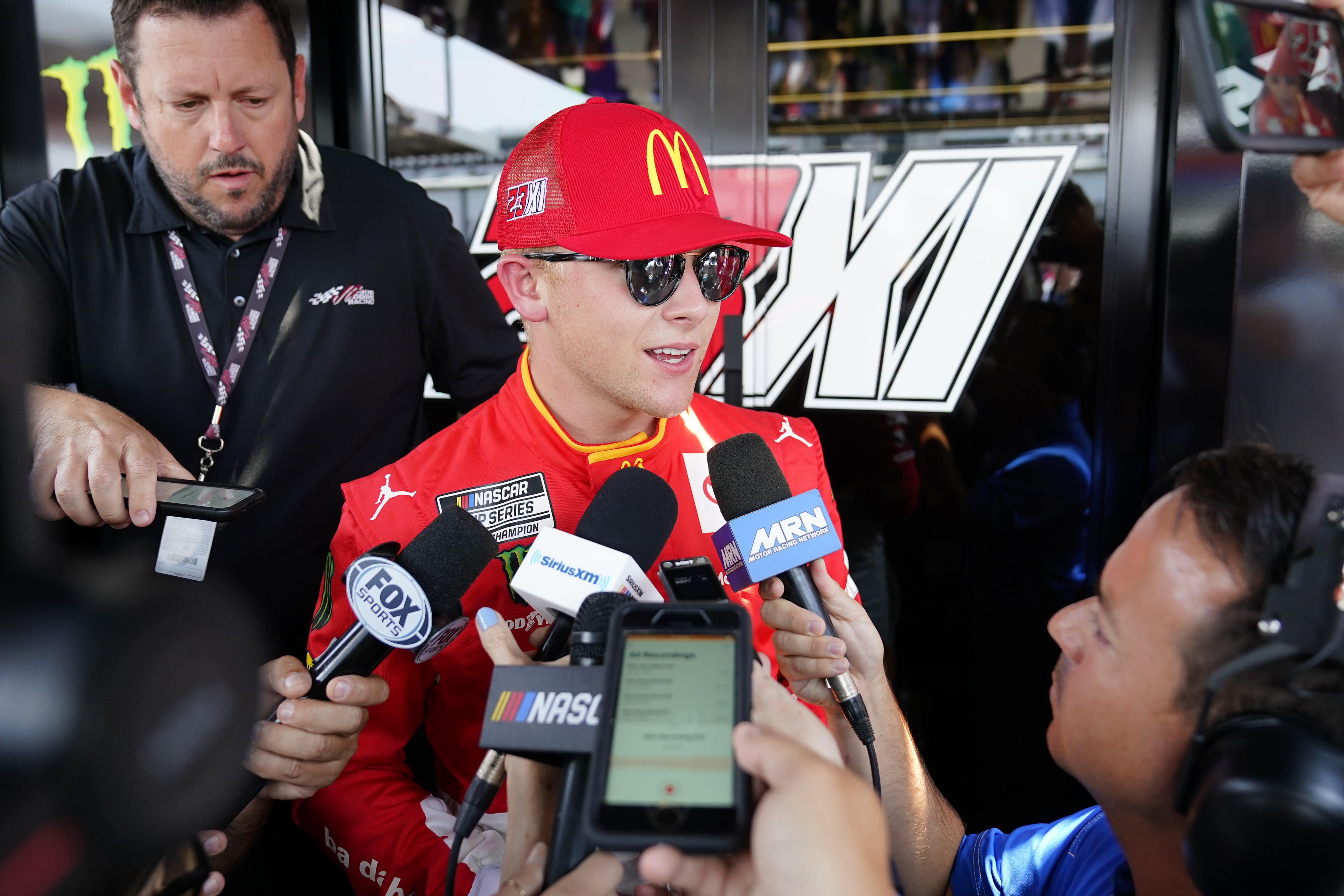 NASCAR driver Ty Gibbs talks to reporters before an auto race at Pocono Raceway, Sunday, July 24, 2022 in Long Pond, Pa.