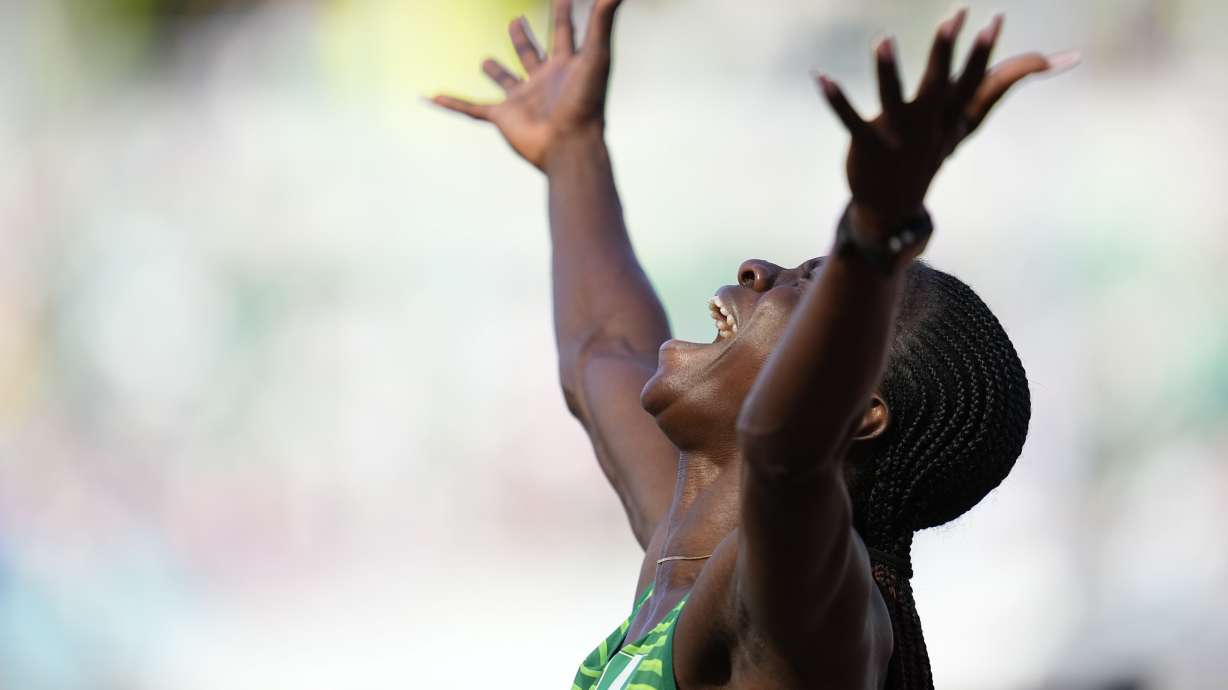 Tobi Amusan, of Nigeria, reacts after winning the women's 100-meter hurdles semifinal at the World Athletics Championships on Sunday, July 24, 2022, in Eugene, Ore.
