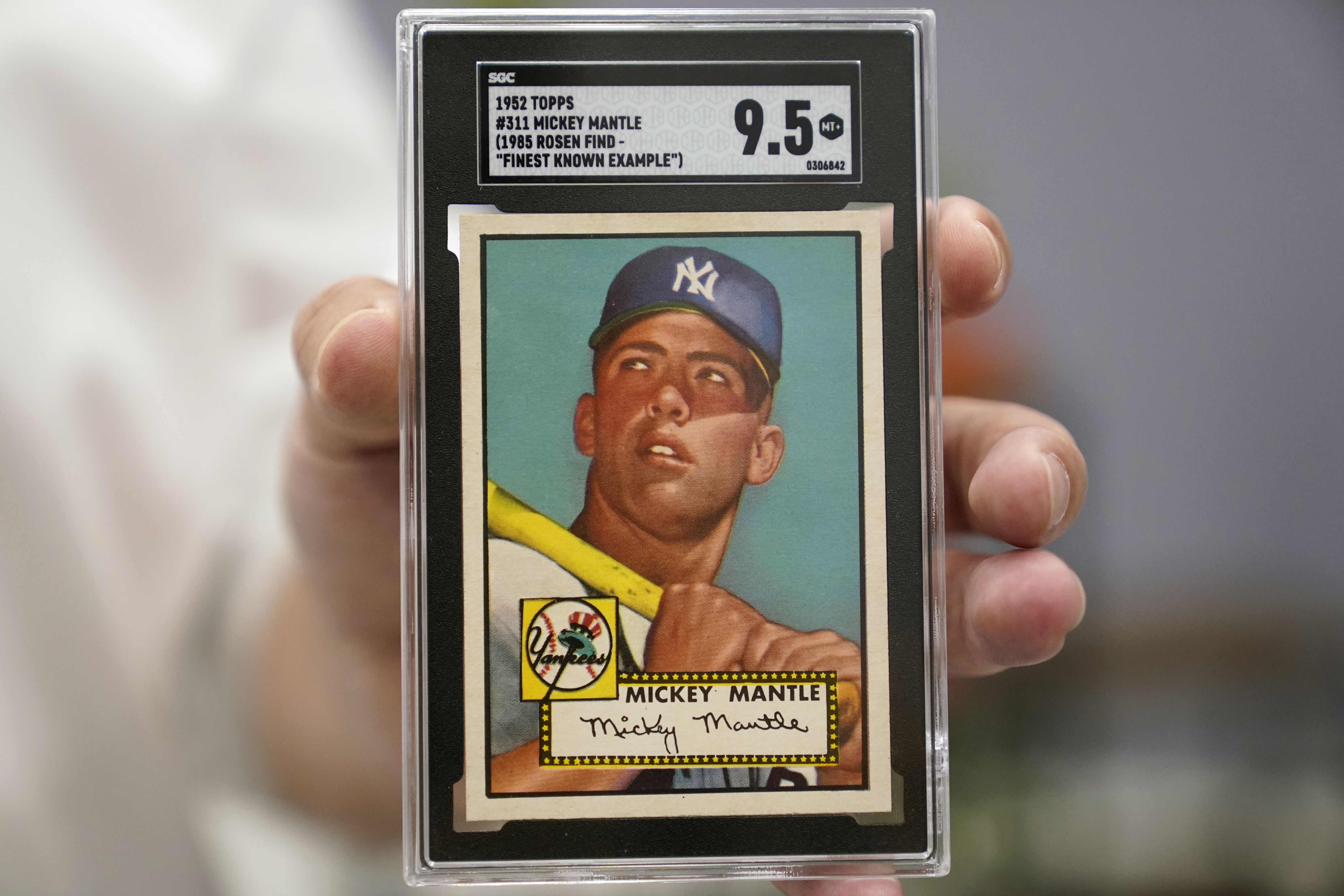 A Mickey Mantle baseball card is displayed at Heritage Auctions in Dallas, Thursday, July 21, 2022. The mint-condition Mantle card is expected to sell well into the millions when bidding ends at the end of the month. 