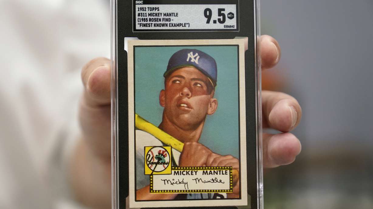 A Mickey Mantle baseball card is displayed at Heritage Auctions in Dallas, Thursday, July 21, 2022. The mint-condition Mantle card is expected to sell well into the millions when bidding ends at the end of the month.