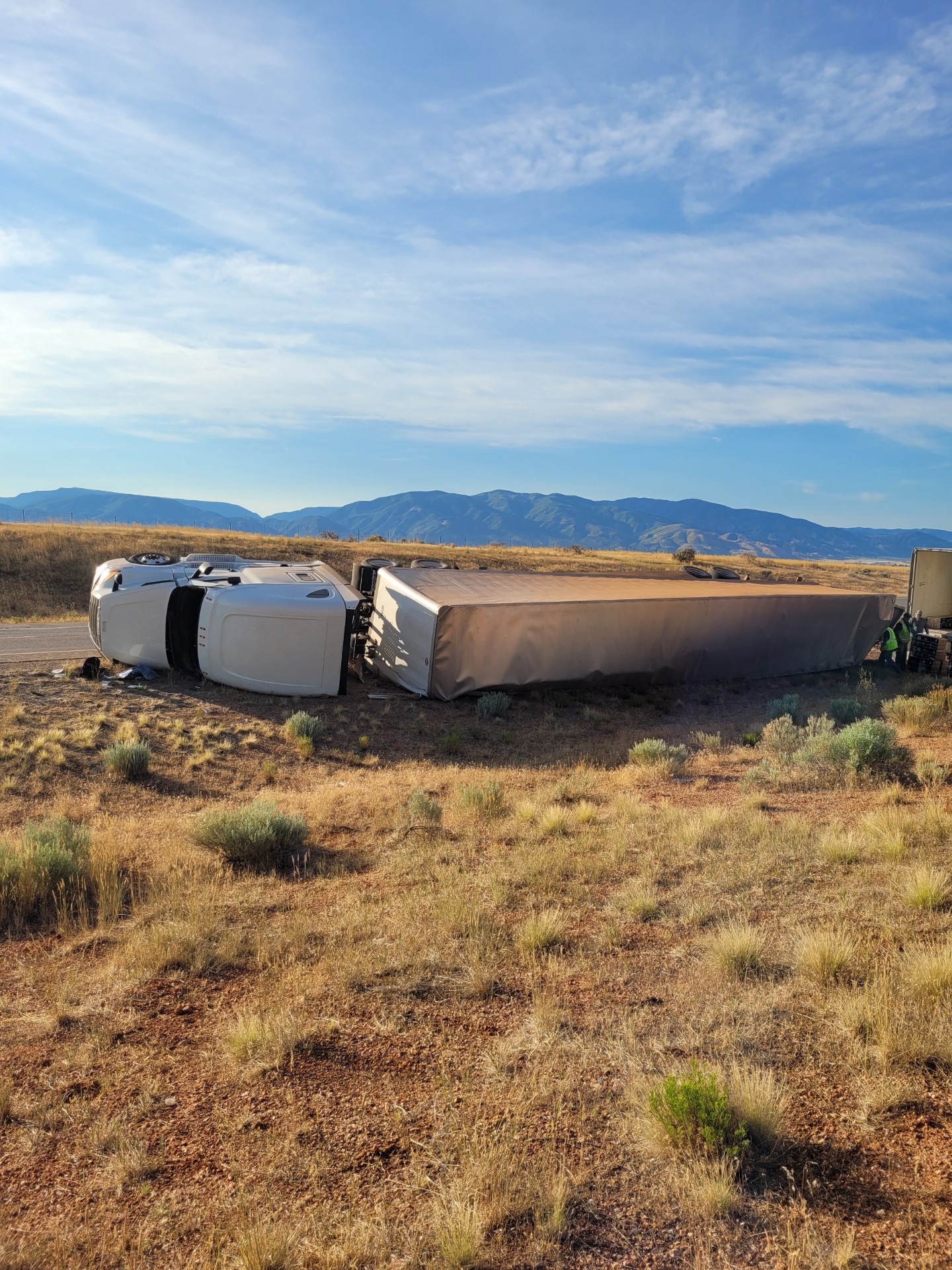 A semitruck driver is in critical condition Monday morning after overturning on 1-15 and blocking all northbound traffic lanes.