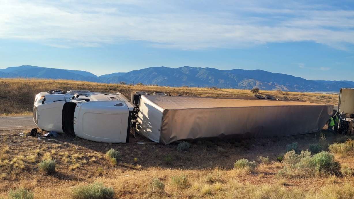 A semitruck driver is in critical condition Monday morning after overturning on 1-15 and blocking all northbound traffic lanes.