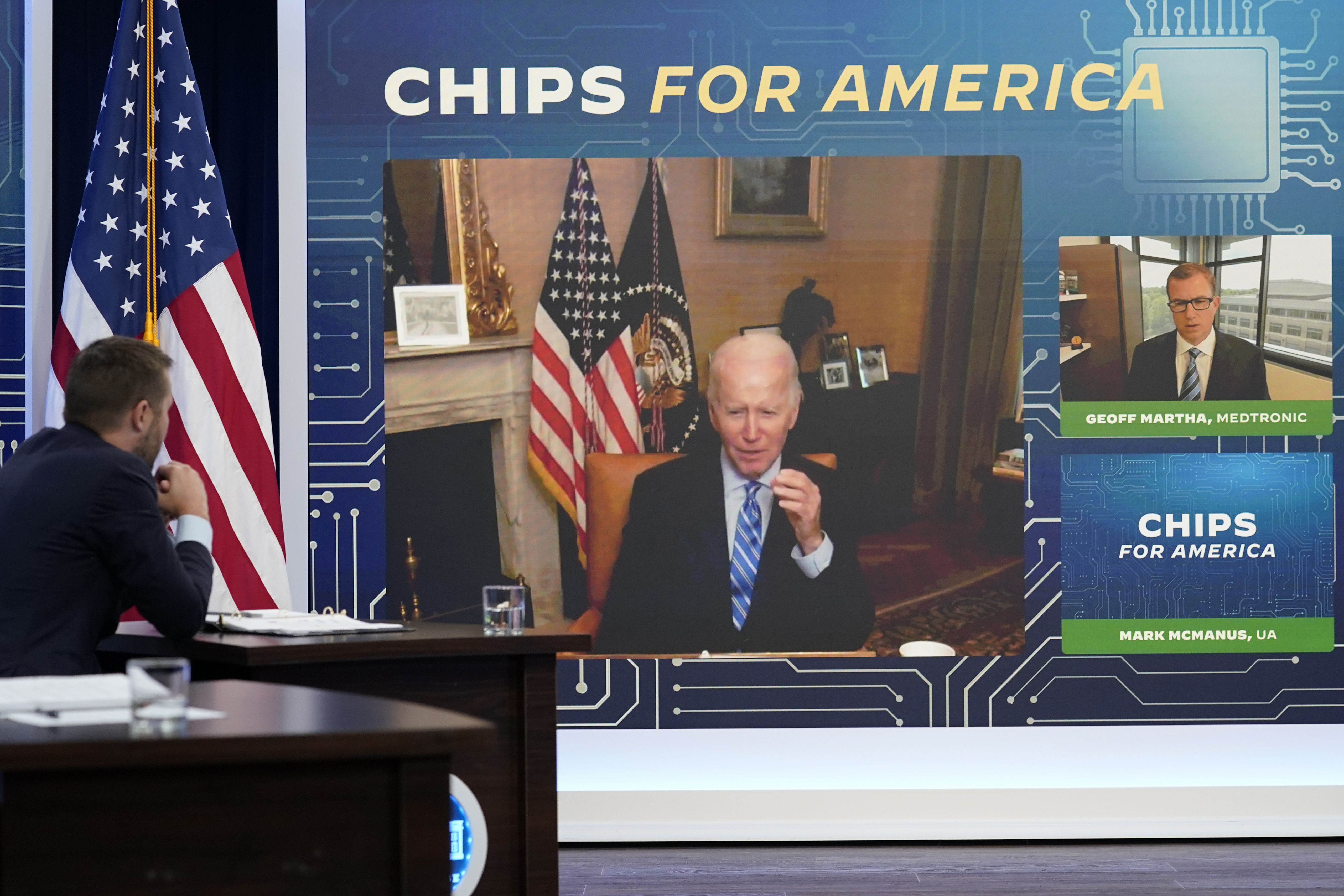 President Joe Biden speaks virtually during an event in the South Court Auditorium on the White House complex in Washington, Monday. Biden, who continues to recover from his coronavirus infection, spoke virtually with business executives and labor leaders to discuss the Chips Act, a proposal to bolster domestic manufacturing.