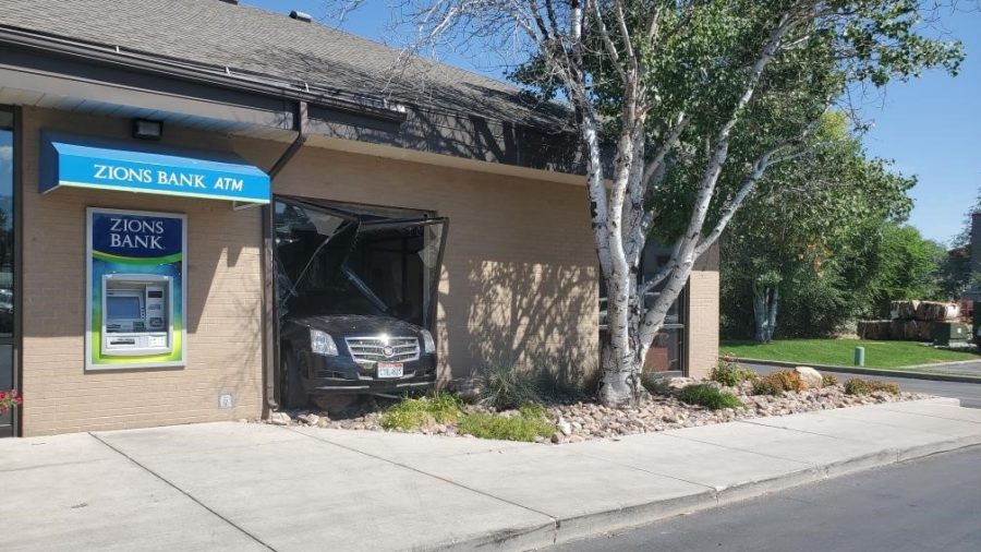 A woman drove a 4-door passenger car through the windows of a Tremonton Zions Bank while in reverse Monday afternoon, police say.