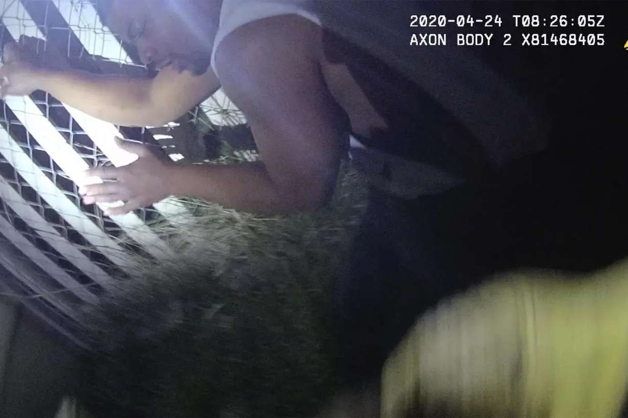 Jeffery Ryans is seen in police body camera footage recorded Friday, April 24, 2020. Ryans was bit by a police K-9 after he was already kneeling with his hands in the air. Salt Lake City police K-9 officer Nickolas Pearce was charged criminally due to the event, and his trial began Tuesday.
