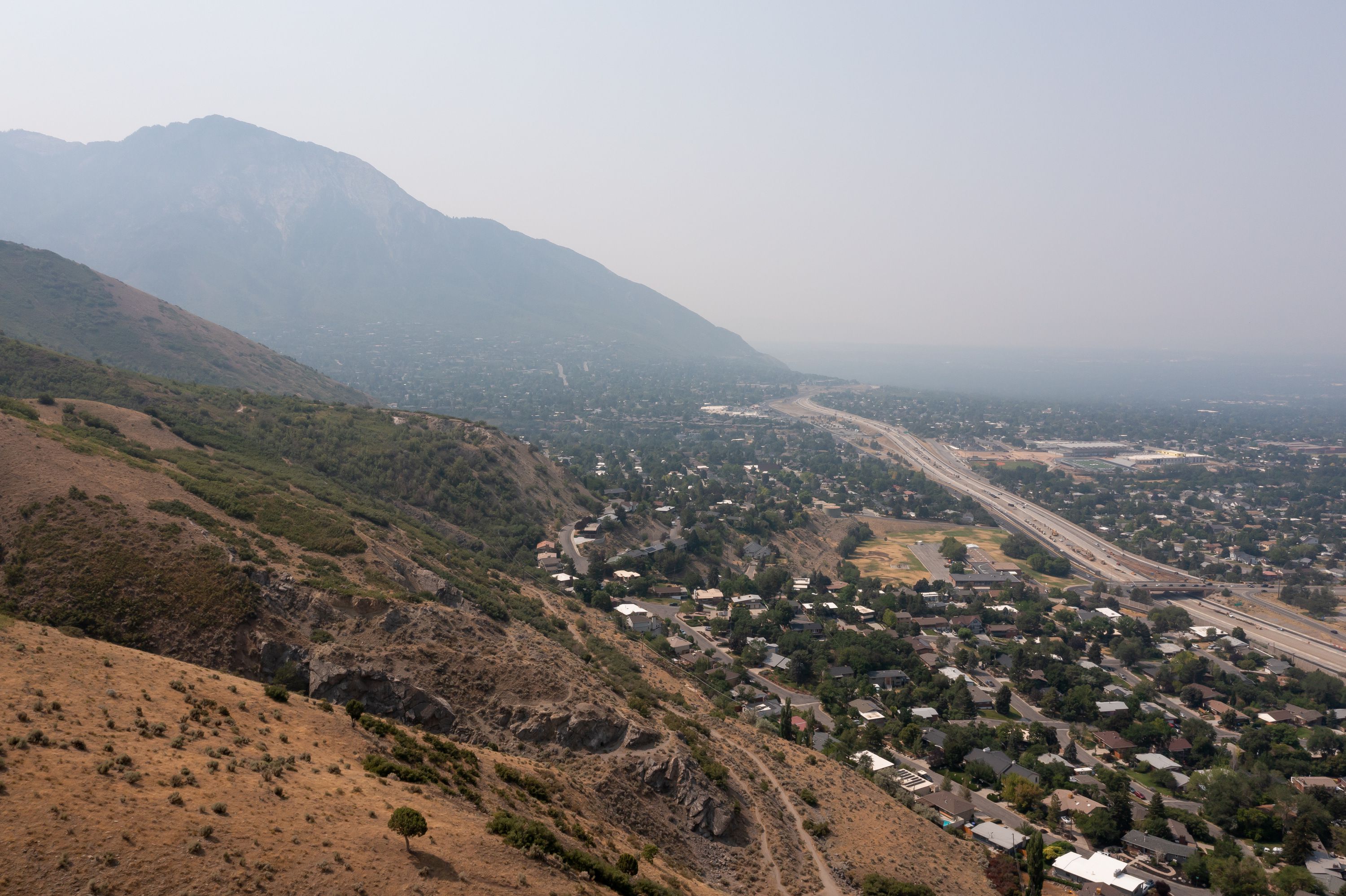 Smoky skies are seen from the base of Grandeur Peak in Millcreek on July 26, 2021. The Wasatch Front is set for some bad air conditions in the coming days, but officials say it isn’t because of other western wildfires.