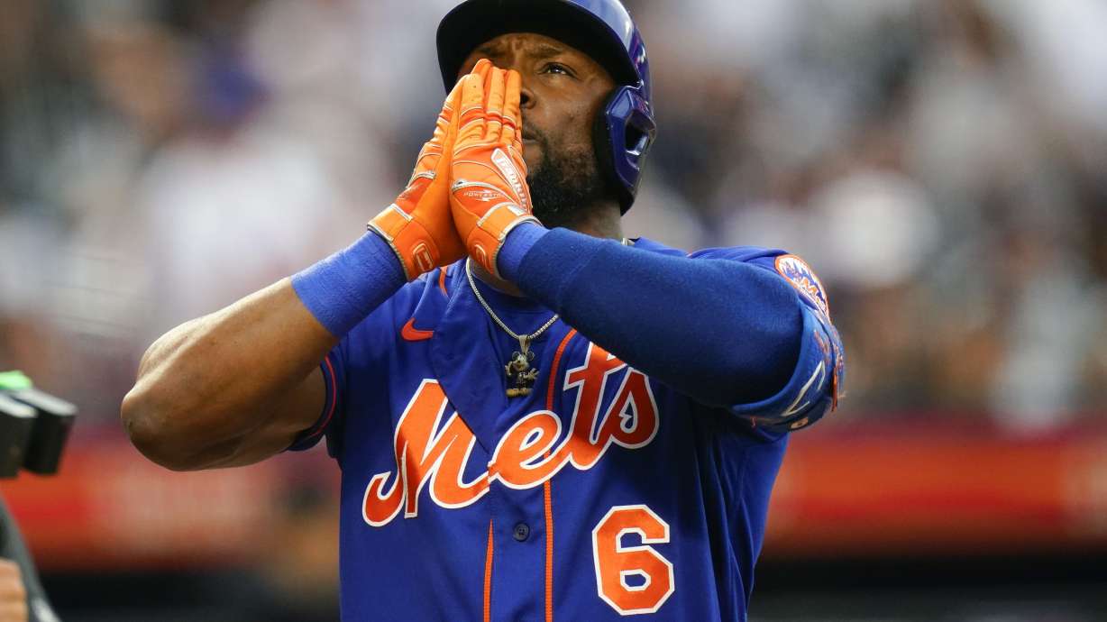 New York Mets' Starling Marte gestures after hitting a home run during the first inning of a baseball game against the New York Yankees Tuesday, July 26, 2022, in New York.