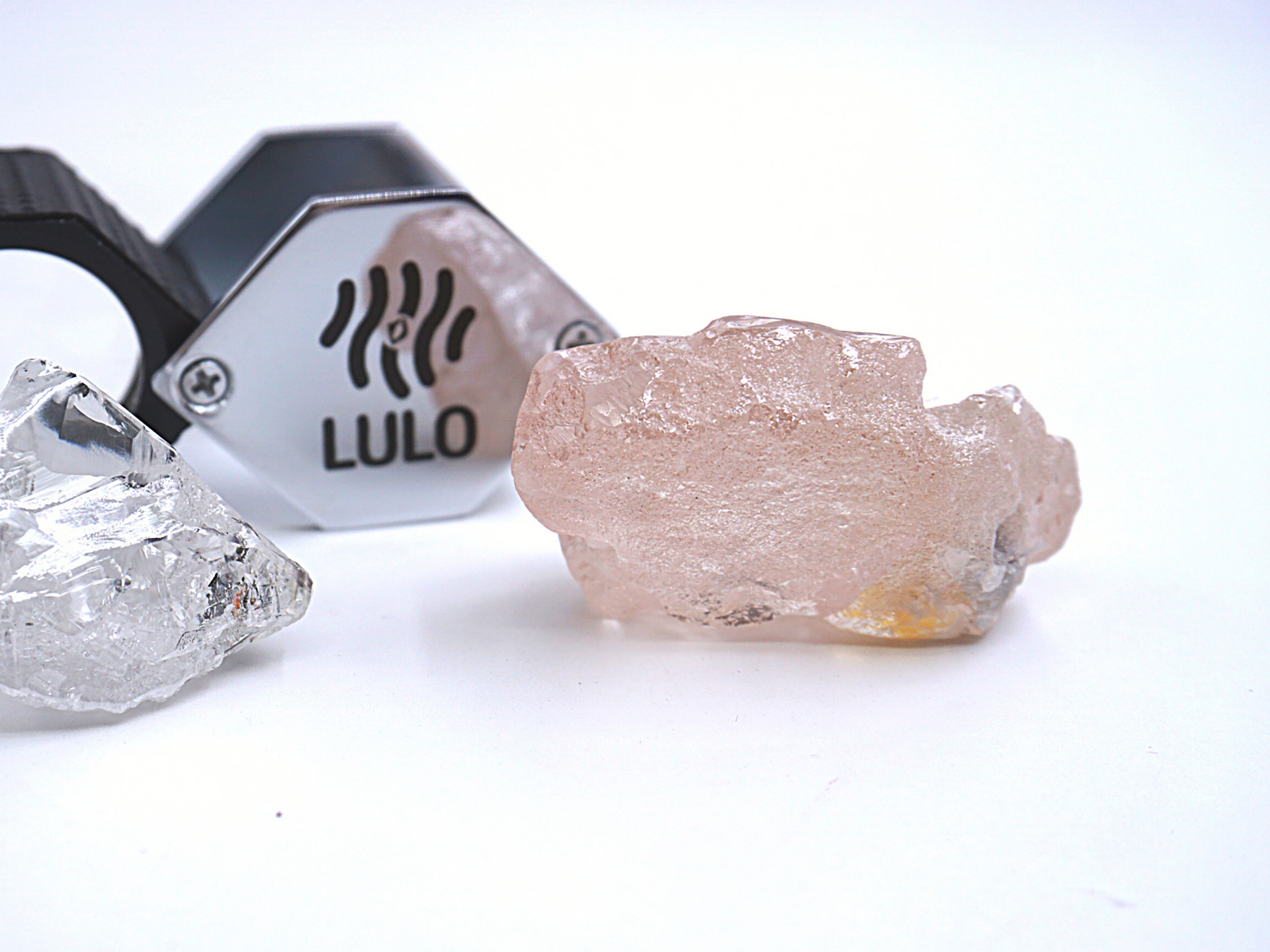 The 170-carat pink diamond, right, is seen on Wednesday. It was recovered from Lulo, Angola. The big pink diamond of 170 carats is claimed to be the largest such gemstone found in 300 years.