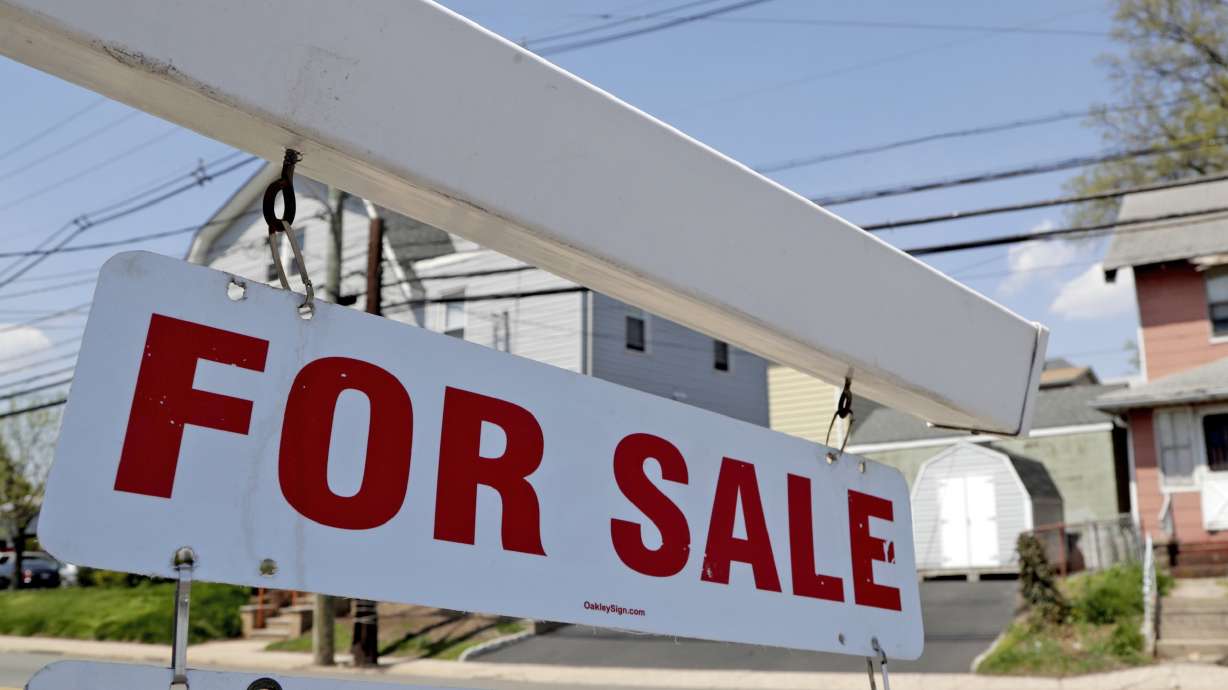 A "for sale" sign hangs from a post outside of a vacant business building in Belleville, N.J., May 3, 2018. The Federal Reserve on Wednesday, raised its benchmark interest rate by a hefty three-quarters of a point for a second straight time in its most aggressive drive in three decades to tame high inflation.