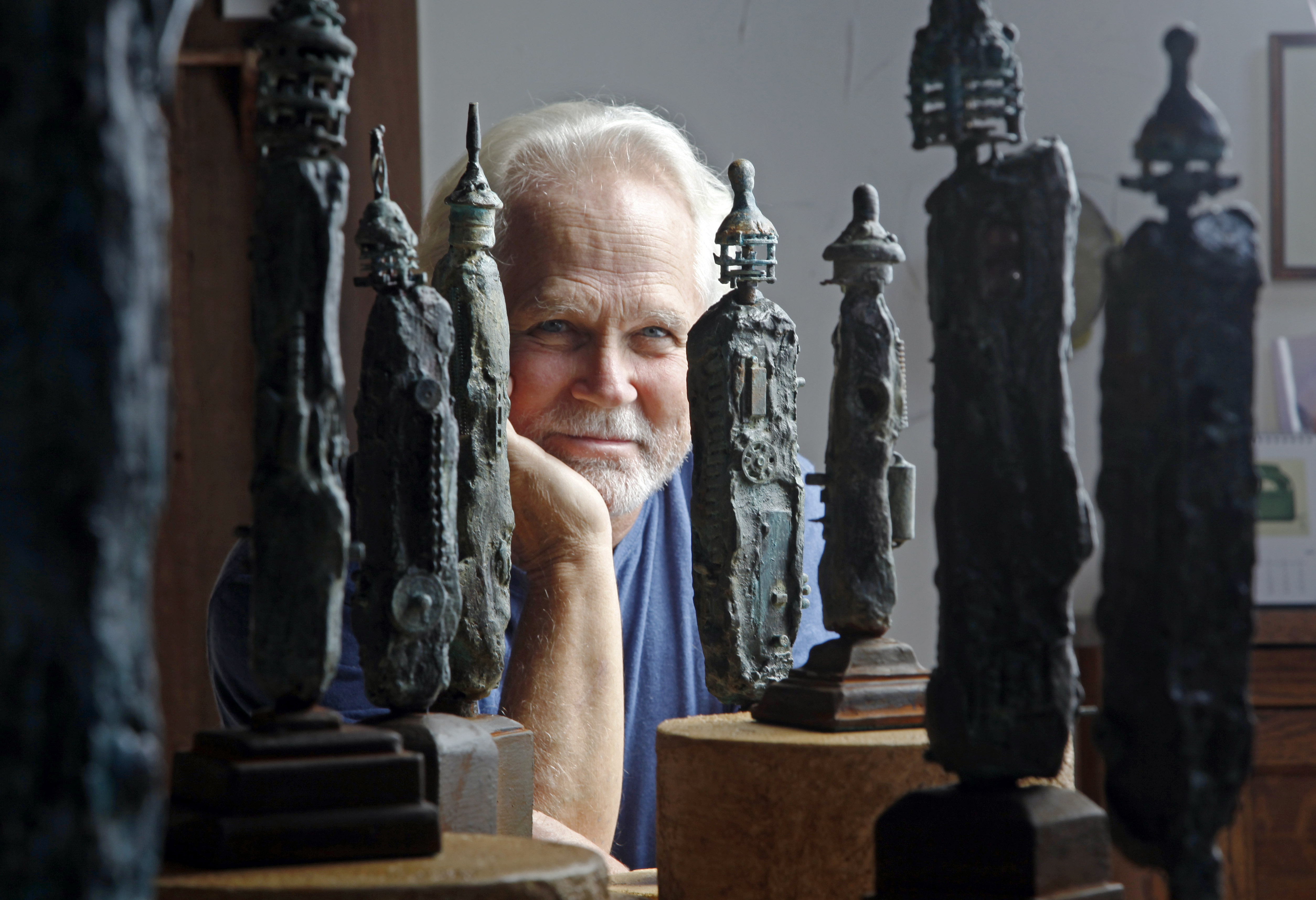 Tony Dow, actor, director and artist, poses with some of his works at his home and studio in the Topanga area of Los Angeles, Sept. 18, 2012. The “Leave It to Beaver” actor Dow has died at age 77. Frank Bilotta, who represented Dow in his work as a sculptor, confirmed his death in an email to the Associated Press on Wednesday.