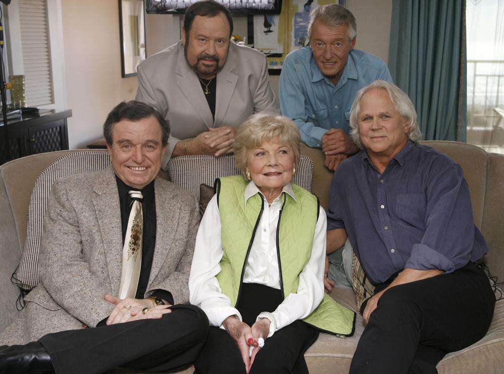Seated from left, Jerry Mathers, Barbara Billingsley and Tony Dow, and, standing from left, Frank Bank and Ken Osmond, pose for a photo as they are reunited to celebrate the 50th anniversary of the television show, "Leave it to Beaver," in Santa Monica, Calif., Sept. 27, 2007. Dow has died at age 77.