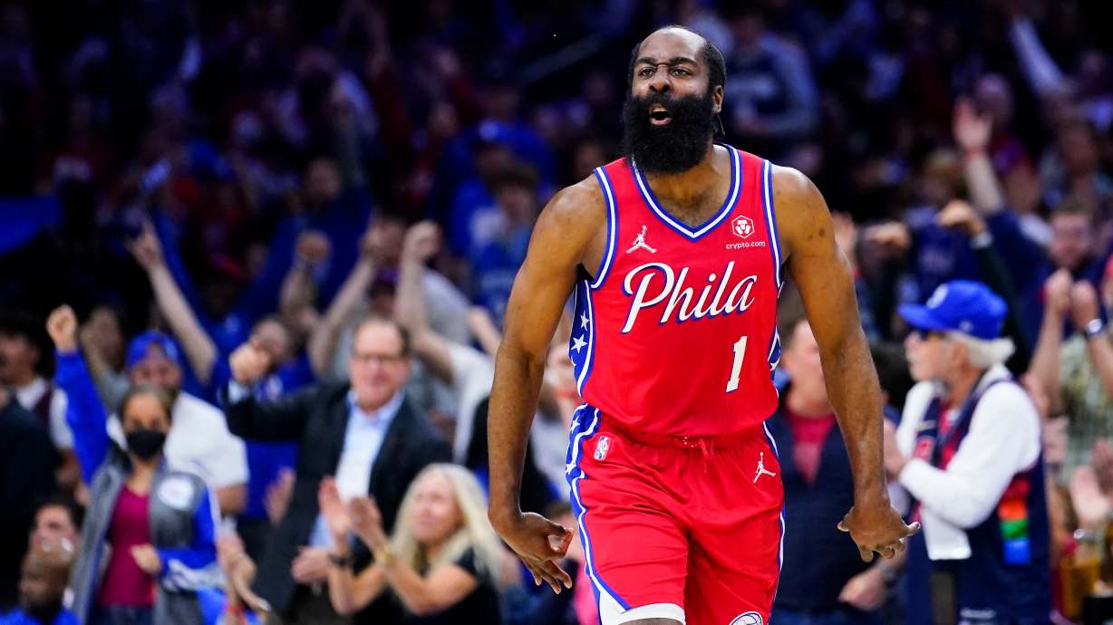 FILE - Philadelphia 76ers' James Harden reacts during the first half of Game 4 of an NBA basketball second-round playoff series against the Miami Heat on May 8, 2022, in Philadelphia. Harden has agreed to terms on a two-year contract to stay with the Philadelphia 76ers and will make about $14.5 million less this coming season than he could have earned under his previous deal, a person with knowledge of the negotiations said Wednesday, July 20.