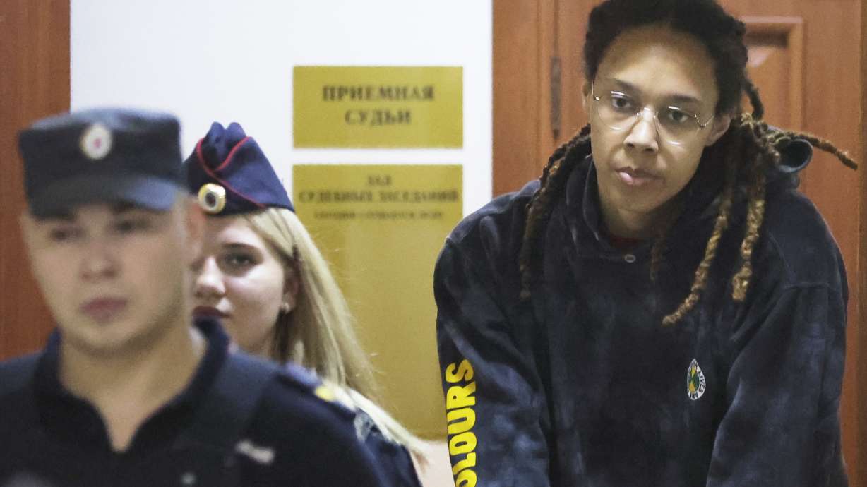 WNBA star and two-time Olympic gold medalist Brittney Griner is escorted to a courtroom for a hearing, in Khimki just outside Moscow, Russia, Monday, July 25, 2022. American basketball star Brittney Griner returns Tuesday to a Russian courtroom for her drawn-out trial on drug charges that could bring her 10 years in prison if convicted.