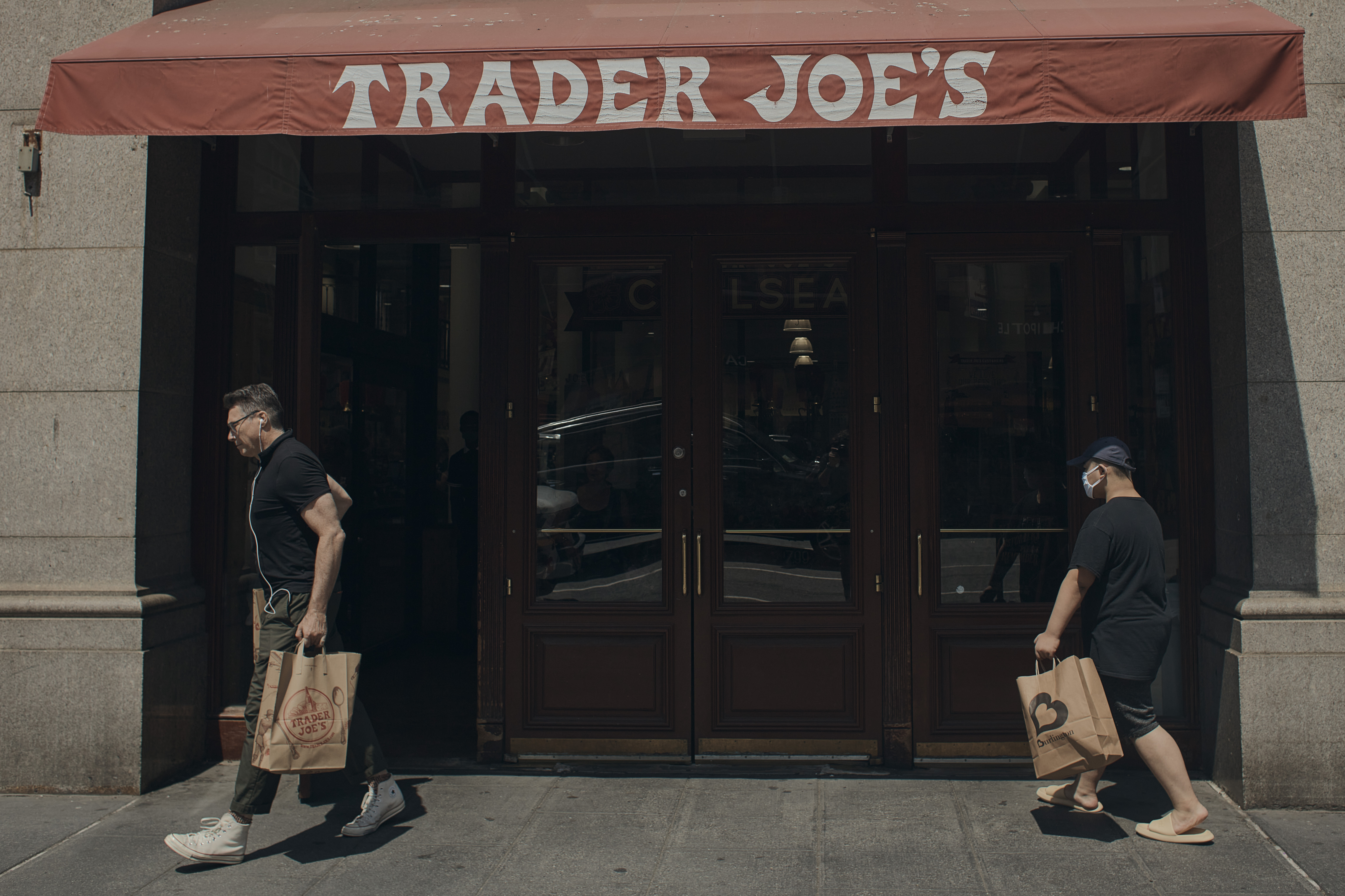 People shop at a supermarket on Wednesday in New York. The Federal Reserve on Wednesday raised its benchmark interest rate by a hefty three-quarters of a point for a second straight time in its most aggressive drive in three decades to tame high inflation.