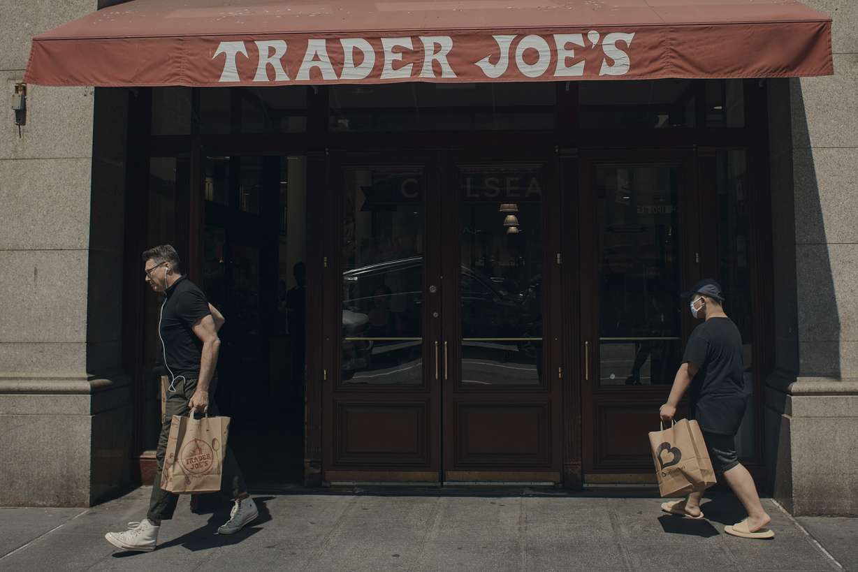 People shop at a supermarket on Wednesday in New York. The Federal Reserve on Wednesday raised its benchmark interest rate by a hefty three-quarters of a point for a second straight time in its most aggressive drive in three decades to tame high inflation.