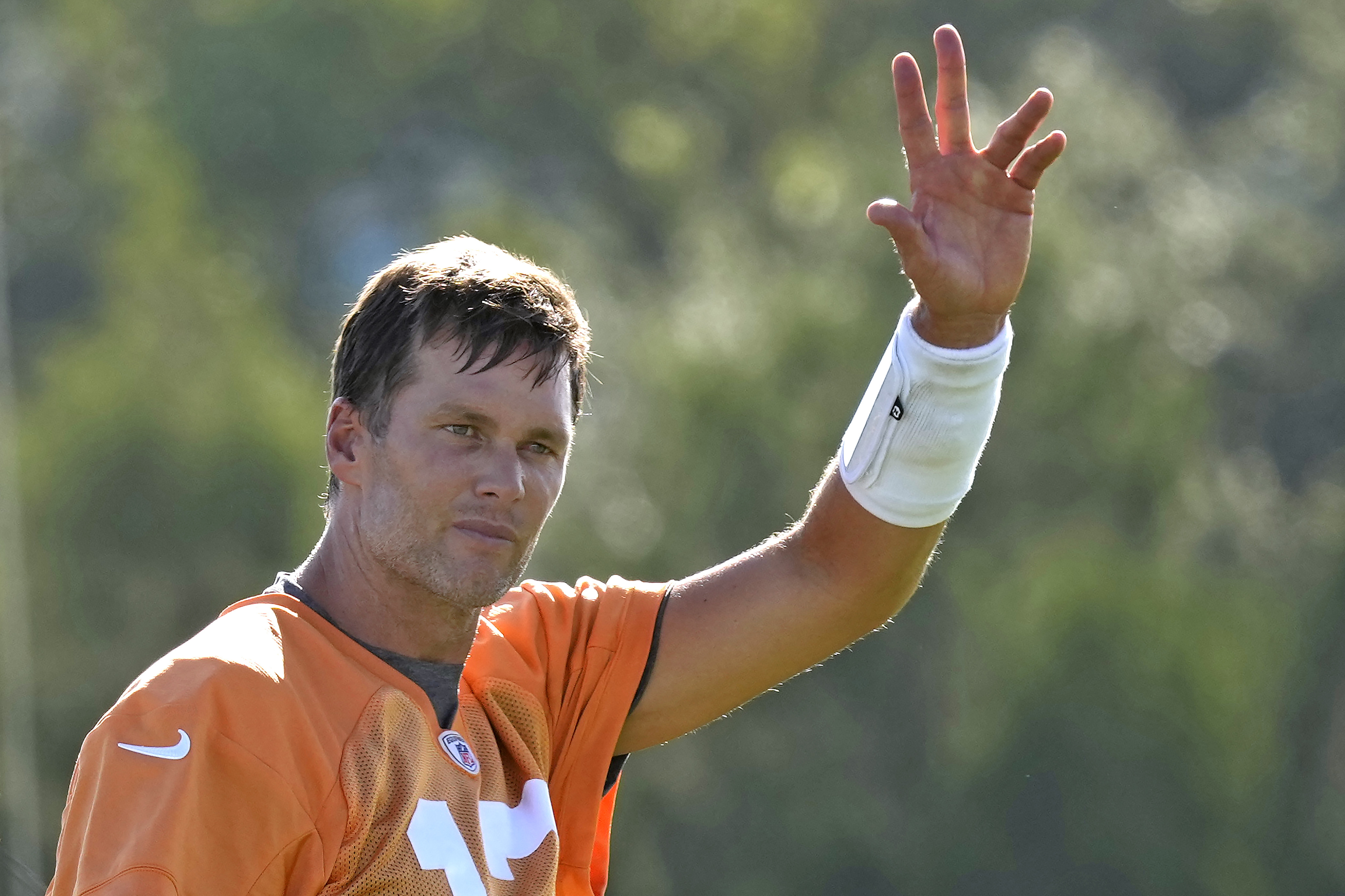Tampa Bay Buccaneers quarterback Tom Brady waves to the fans during an NFL football training camp practice Wednesday, July 27, 2022, in Tampa, Fla. 
