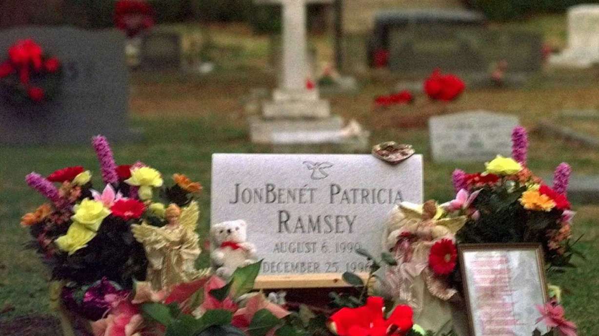 Flowers, pictures and stuffed animals adorn the gravesite of JonBenét Patricia Ramsey early Friday, Dec. 26, 1997, at the St. James Episcopal Church Cemetery in Marietta, Ga. The JonBenét Ramsey murder case has been cold since 1996 but it still captivates the nation.