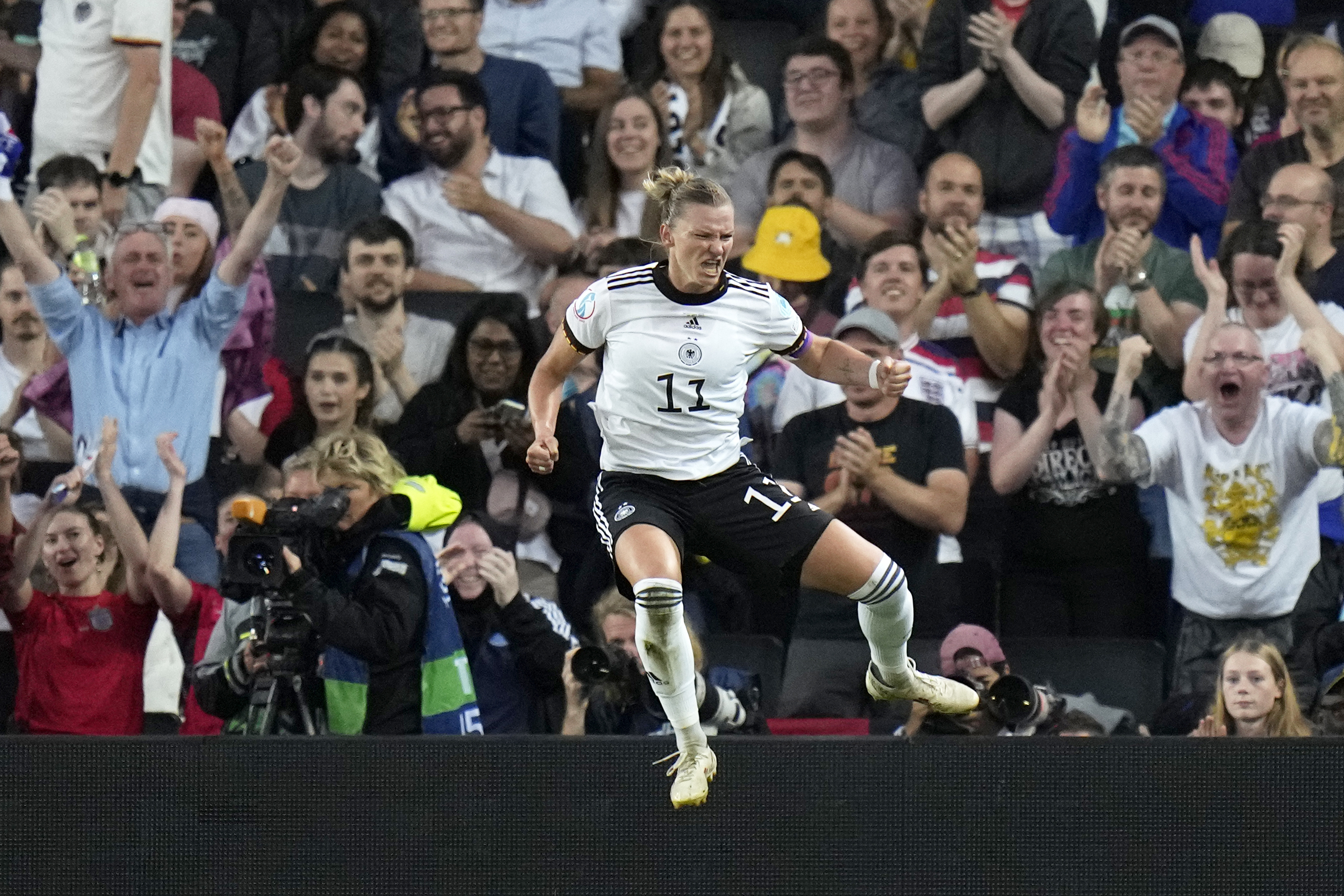 Germany's Alexandra Popp celebrates after scoring the opening goal during the Women Euro 2022 semifinal soccer match between Germany and France at Stadium MK in Milton Keynes, England, Wednesday, July 27, 2022. 