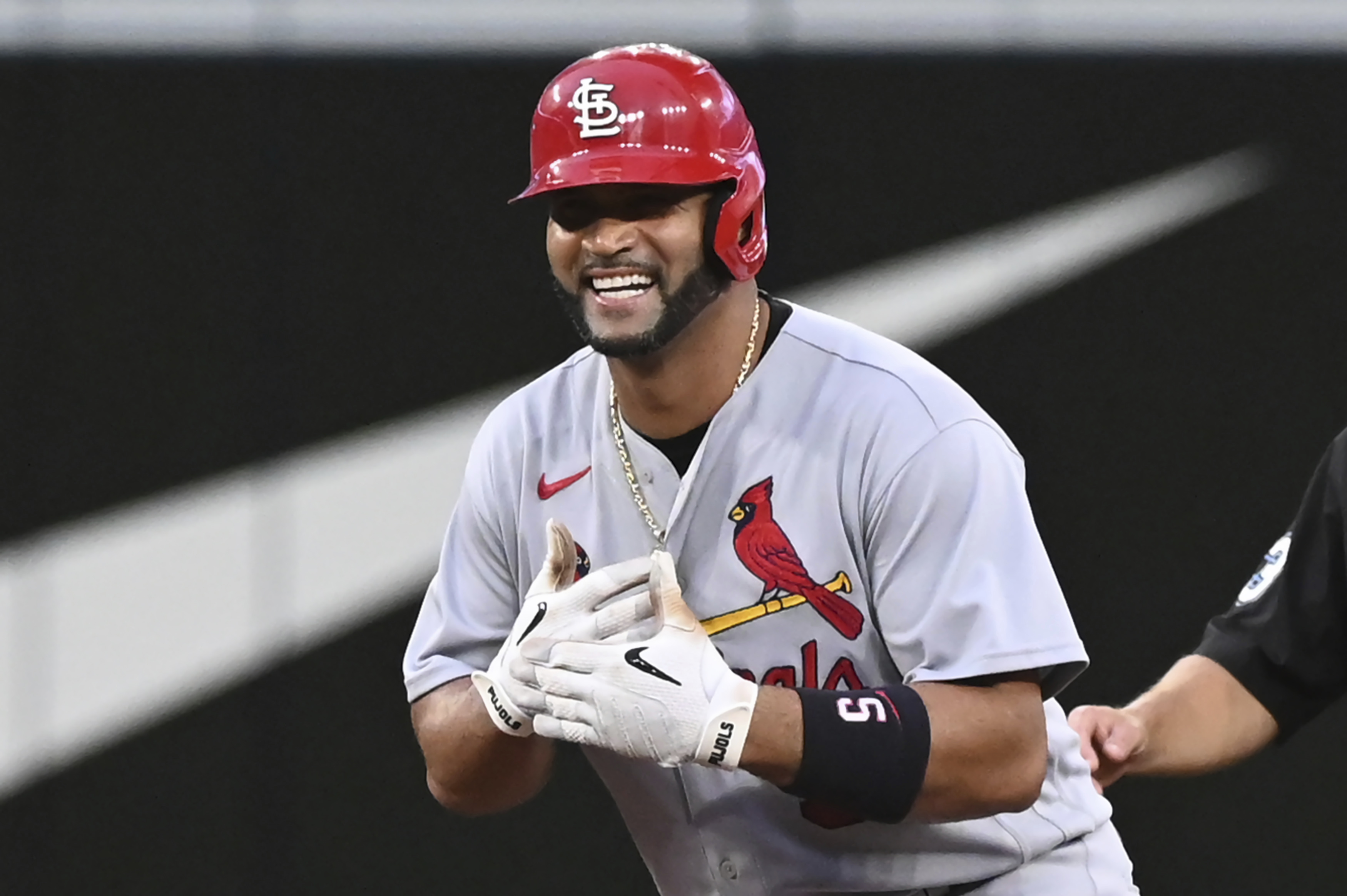 St. Louis Cardinals' Albert Pujols gestures to the dugout after hitting a double off Toronto Blue Jays starting pitcher Kevin Gausman during the fourth inning of a baseball game Wednesday, July 27, 2022, in Toronto. 