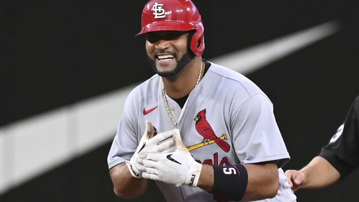 St. Louis Cardinals' Albert Pujols gestures to the dugout after hitting a double off Toronto Blue Jays starting pitcher Kevin Gausman during the fourth inning of a baseball game Wednesday, July 27, 2022, in Toronto.