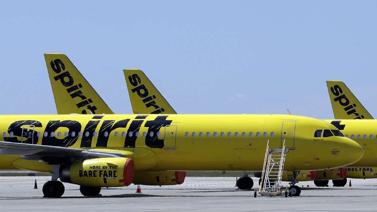 A line of Spirit Airlines jets sit on the tarmac at Orlando International Airport on May 20, 2020, in Orlando, Fla. JetBlue has agreed to buy Spirit Airlines in a $3.8 billion deal, according to a Thursday announcement.