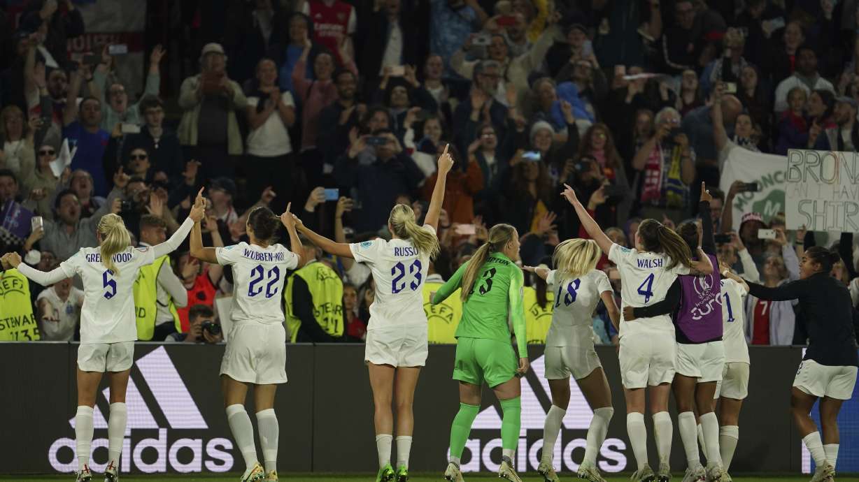 England players celebrate at the end of the Women Euro 2022 semi final soccer match between England and Sweden at Bramall Lane Stadium in Sheffield, England, Tuesday, July 26, 2022.