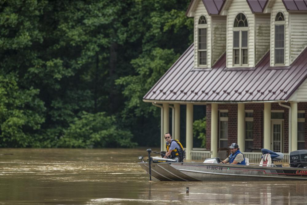 Homes are flooded by Lost Creek, Ky., on Thursday. Heavy rains have caused flash flooding and mudslides as storms pound parts of central Appalachia. Kentucky Gov. Andy Beshear says it's some of the worst flooding in state history.